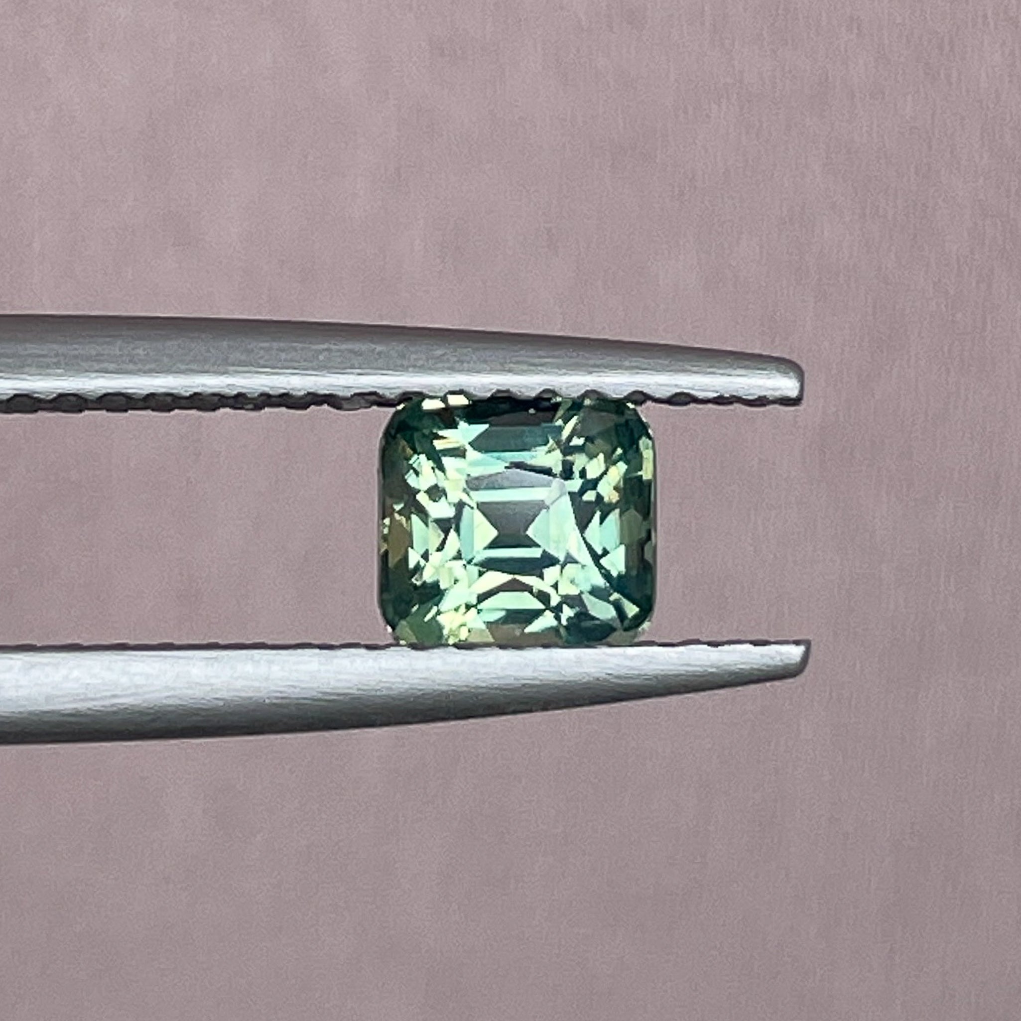 Natural pale green sapphire 1.06 Ct cushion cut loose gemstone from NASHGEMS, perfect for engagement rings or custom jewelry.