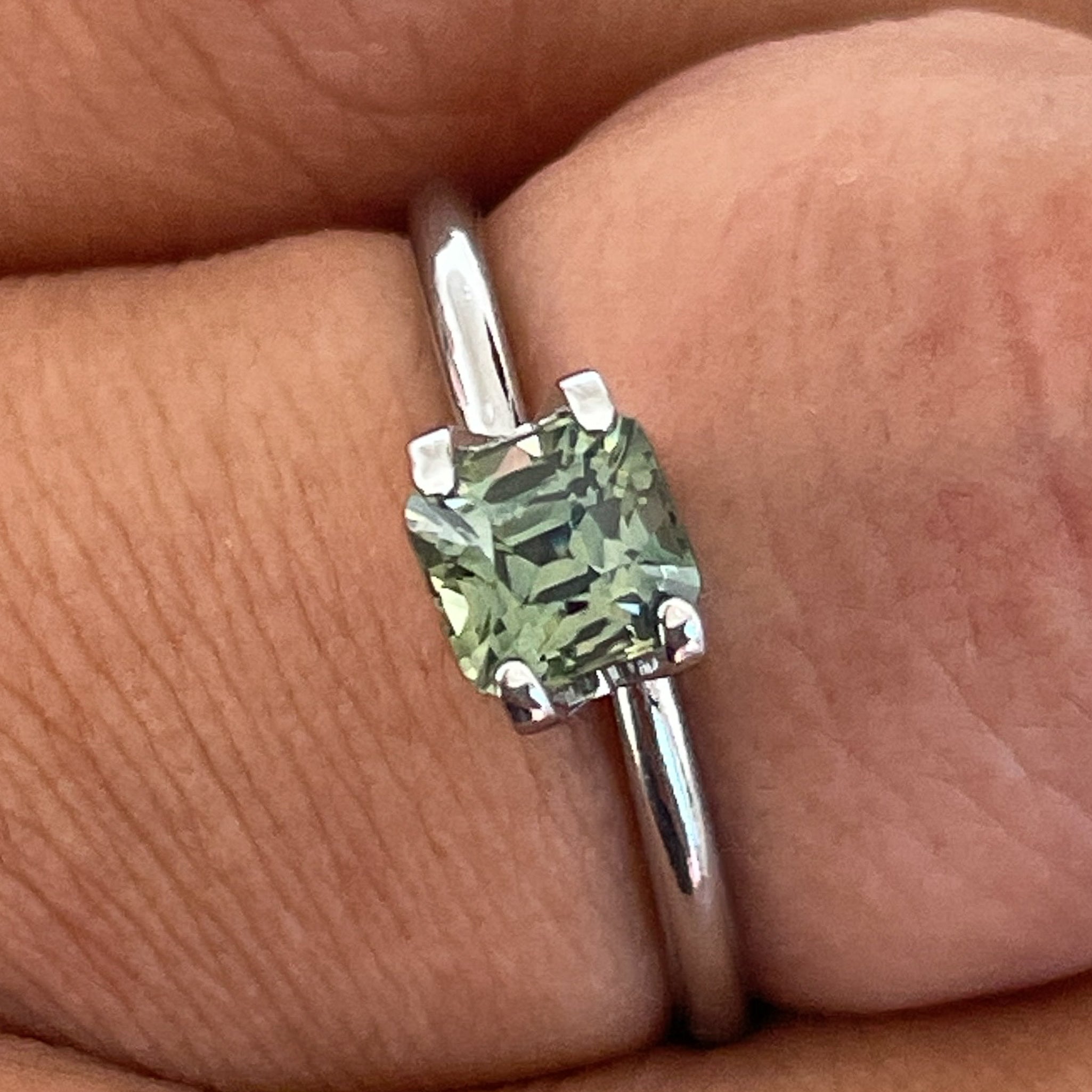 Natural pale green teal sapphire 1.06 Ct cushion cut loose gemstone by NASHGEMS, ideal for engagement rings or custom jewelry.