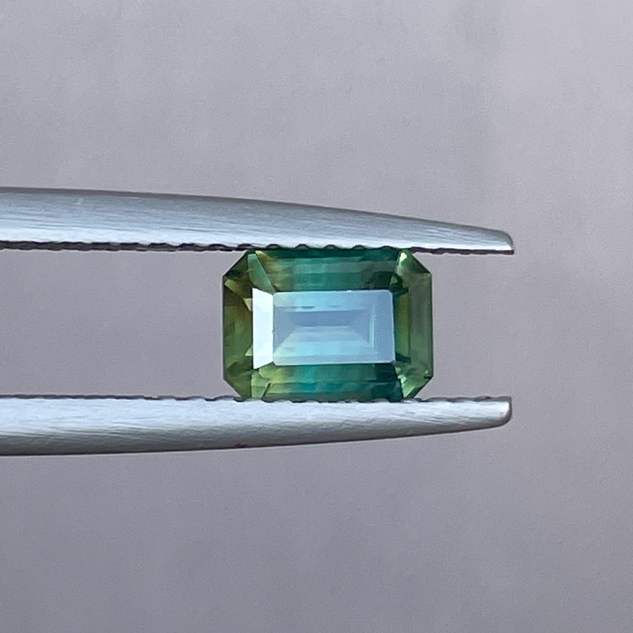 Teal natural bi-color sapphire loose gemstone, 1.13 Ct emerald cut, no heat, ideal for engagement rings or custom jewelry.