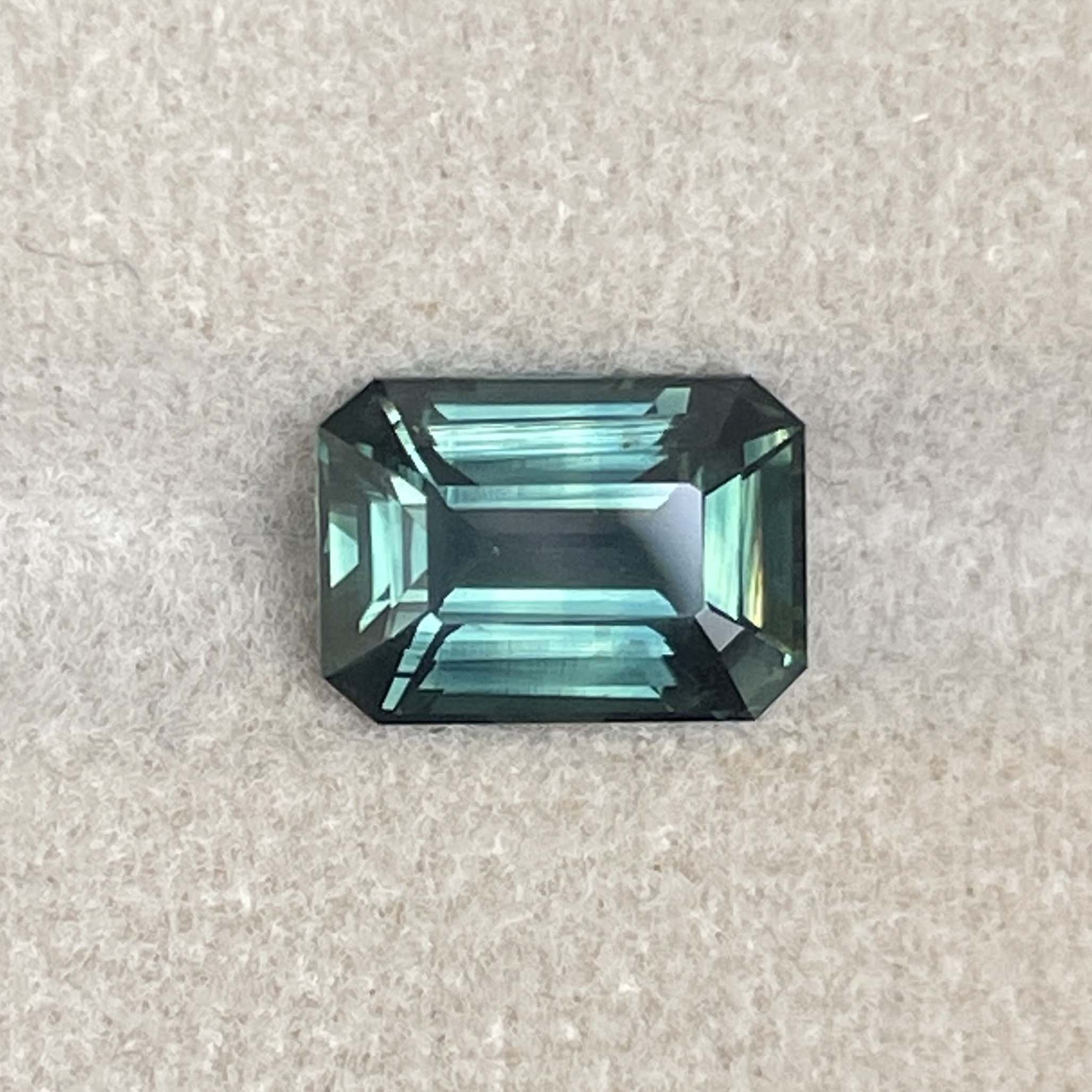 Natural green sapphire 3.03 Ct emerald cut loose gemstone from NASHGEMS, ideal for engagement rings, teal color, no heat treatment.