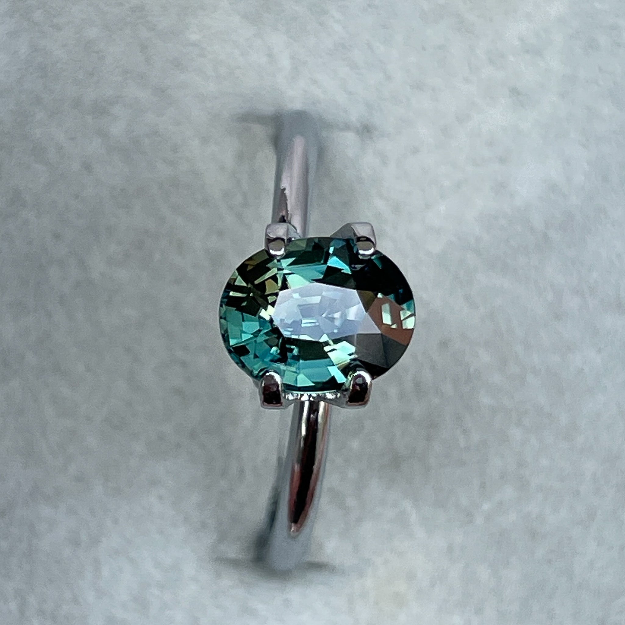 Teal green sapphire loose gemstone, 1.52 ct oval cut, heat treated, ideal for engagement rings or custom jewelry by NASHGEMS.