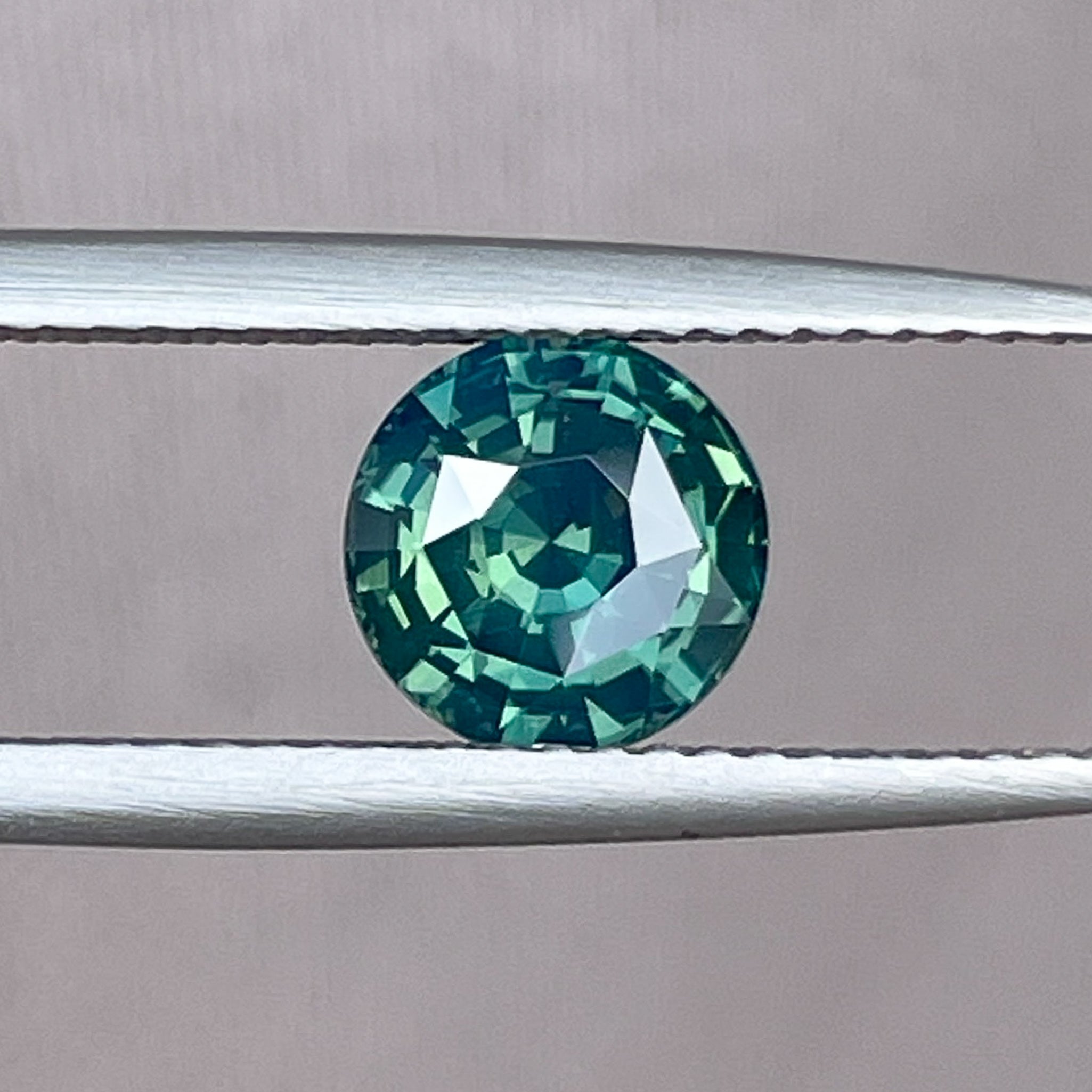 Natural forest green sapphire 1.83 Ct round cut teal loose gemstone from NASHGEMS, ideal for engagement rings or custom jewelry.
