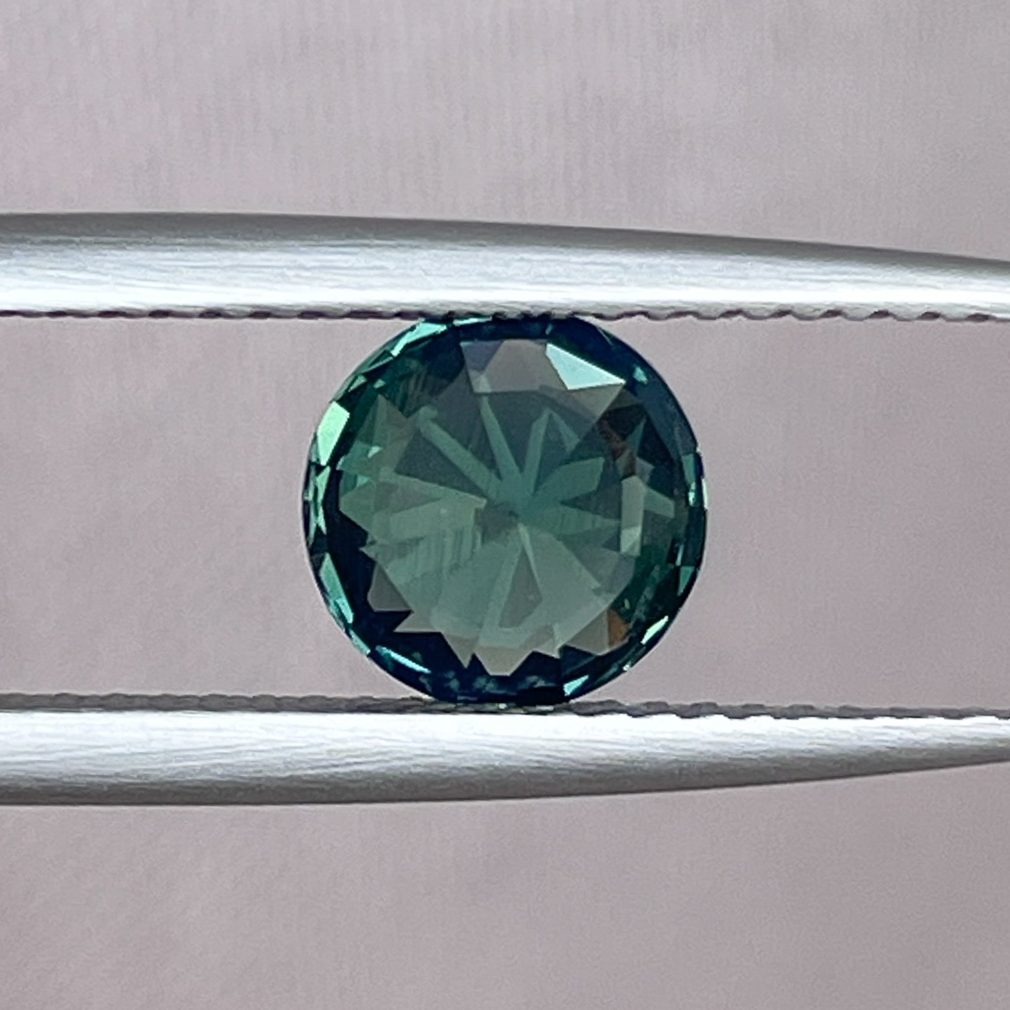 Natural forest green sapphire, 1.83 ct round cut, no heat teal sapphire from NASHGEMS, ideal for engagement or custom jewelry.