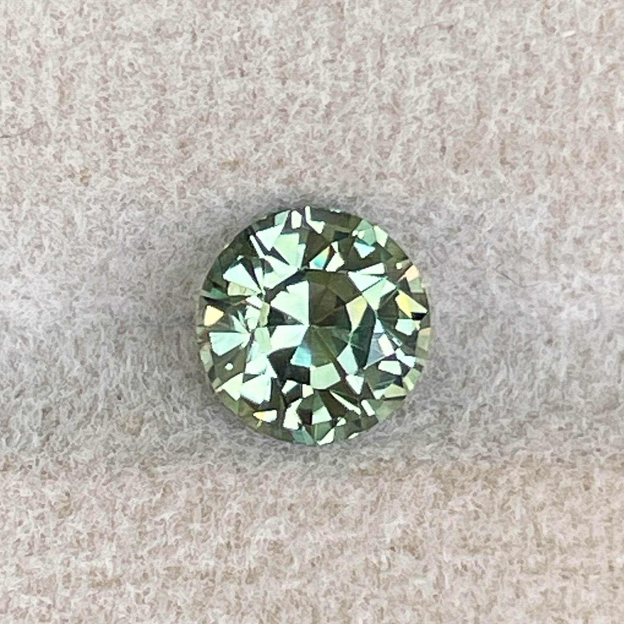 Natural pale green teal sapphire, 1.90 ct round cut loose gemstone by NASHGEMS, ideal for engagement rings or custom jewelry.