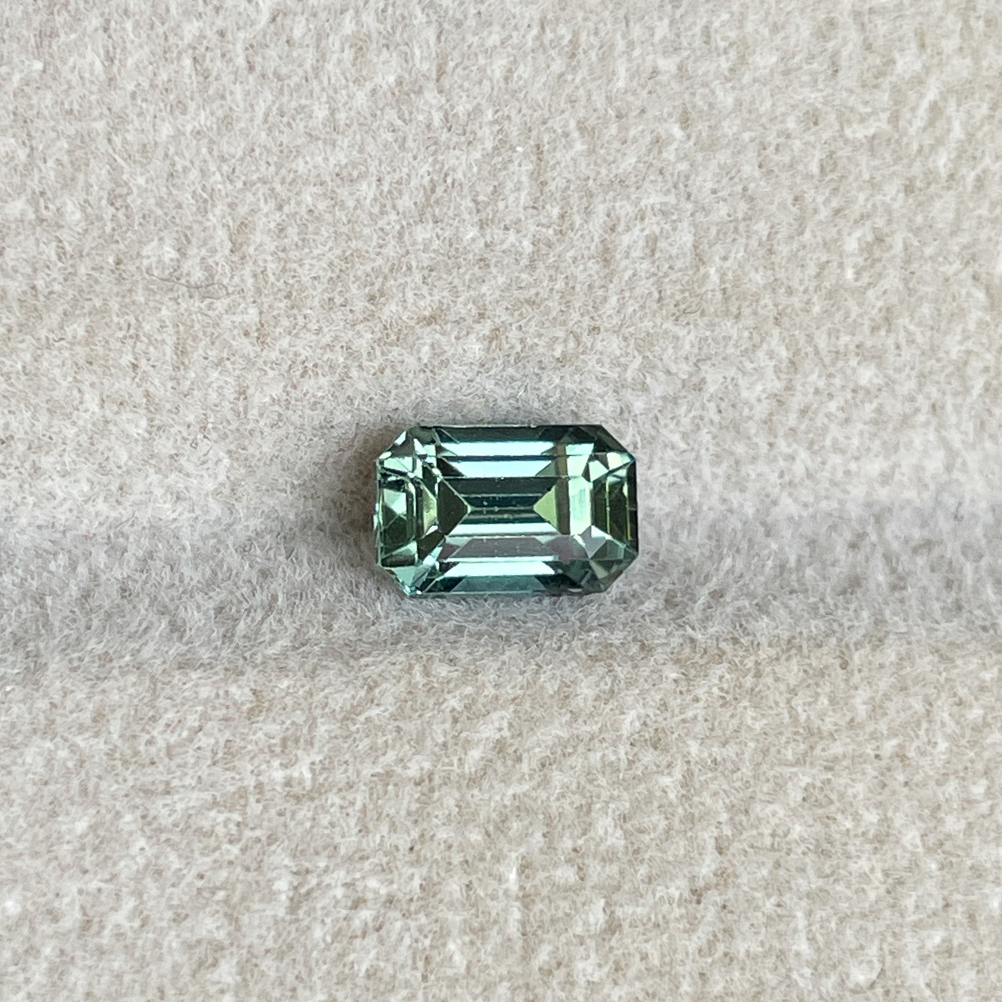 Teal emerald cut natural pale green sapphire, 1.24 Ct, loose no-heat gemstone by NASHGEMS for engagement or custom jewelry.