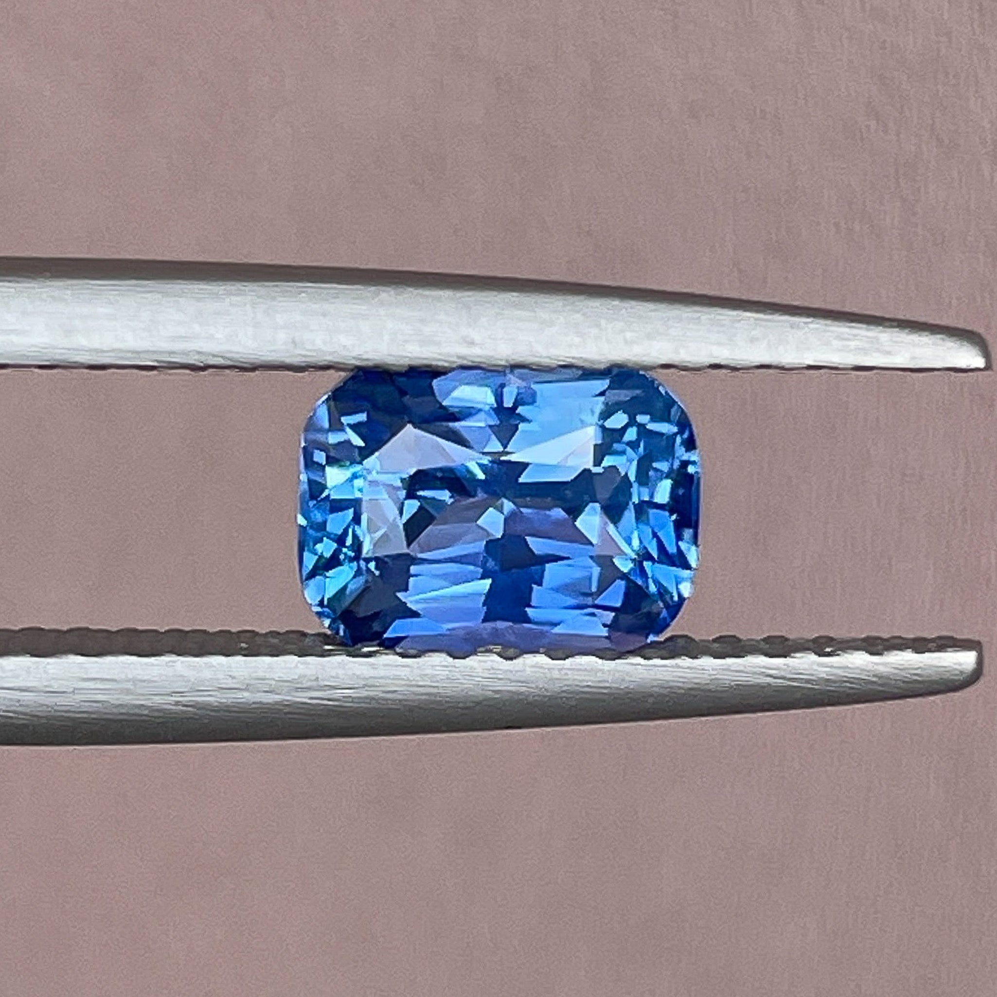 Natural Ceylon Blue Sapphire, 1.60 Ct cushion cut, vivid blue loose gemstone from NASHGEMS for jewelry or engagement.