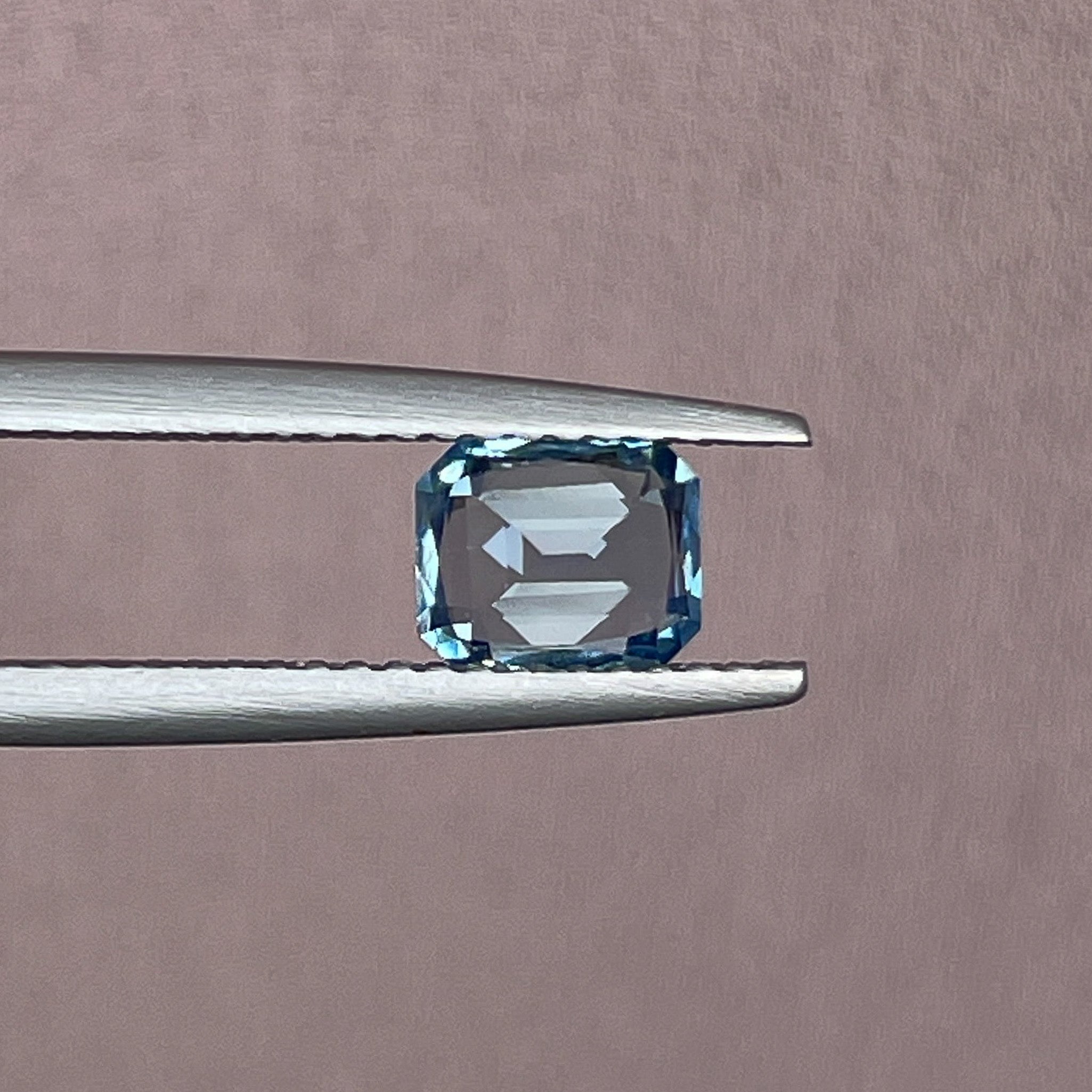 Natural pale blue teal sapphire, 1.08 ct emerald cut loose gemstone by NASHGEMS, ideal for engagement or custom jewelry.