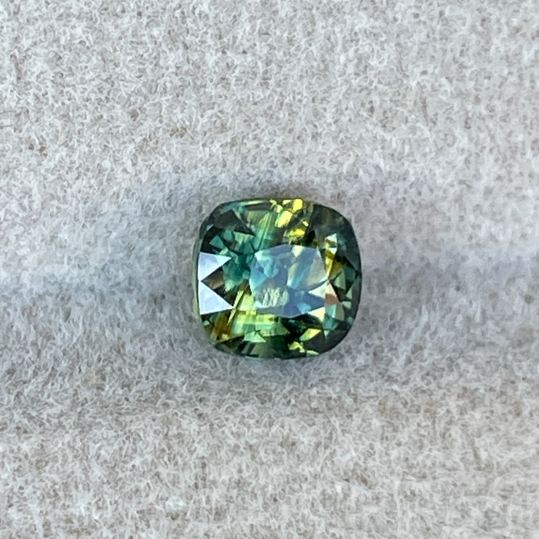 Natural Australian teal Parti Sapphire 1.10 Ct cushion cut loose gemstone by NASHGEMS, ideal for engagement rings or custom jewelry.