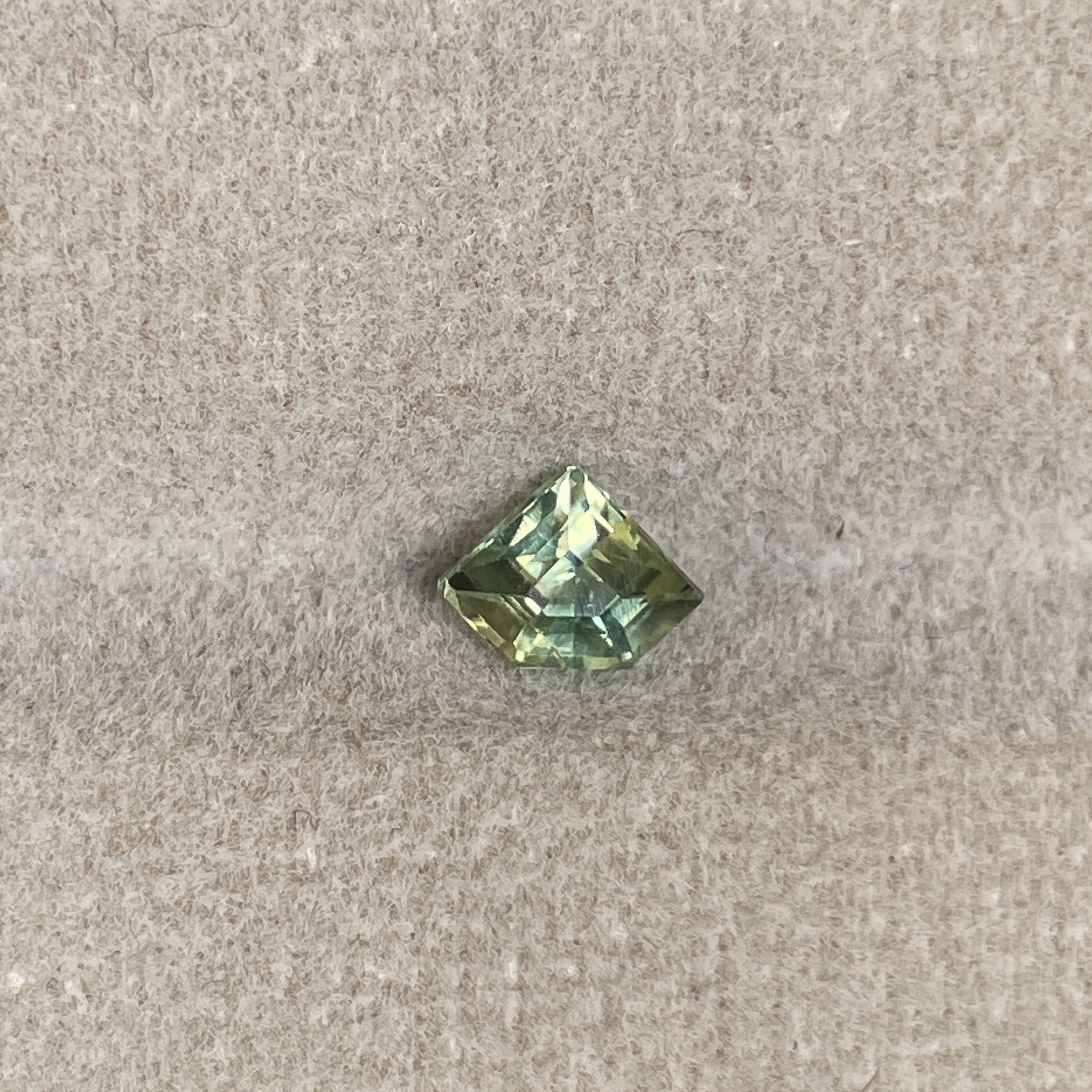Natural pale green yellow sapphire, 0.72 Ct shield cut loose teal sapphire from NASHGEMS for engagement or custom jewelry.