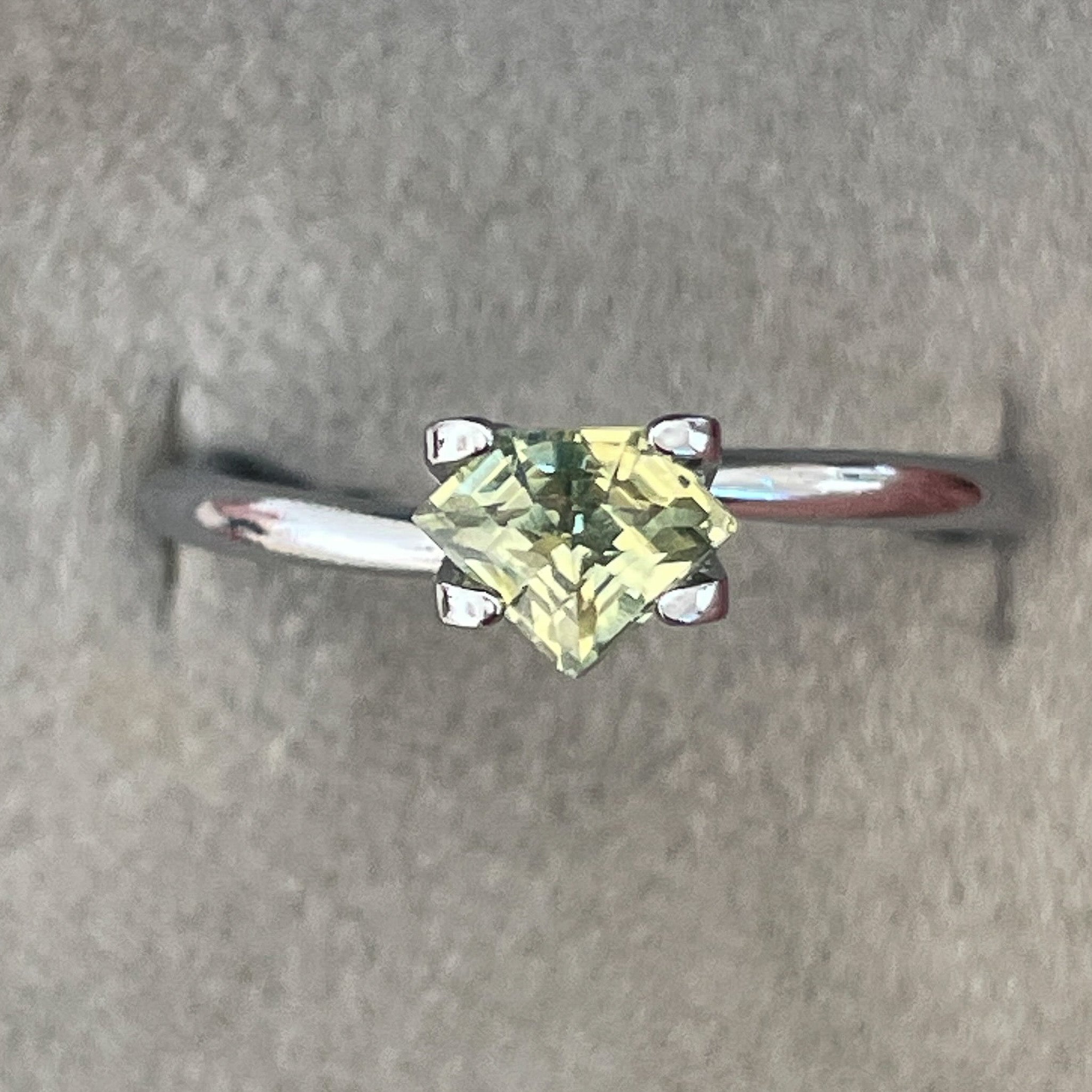 Natural teal yellow sapphire 0.72 Ct shield cut loose gemstone by NASHGEMS, ideal for engagement rings or custom jewelry.