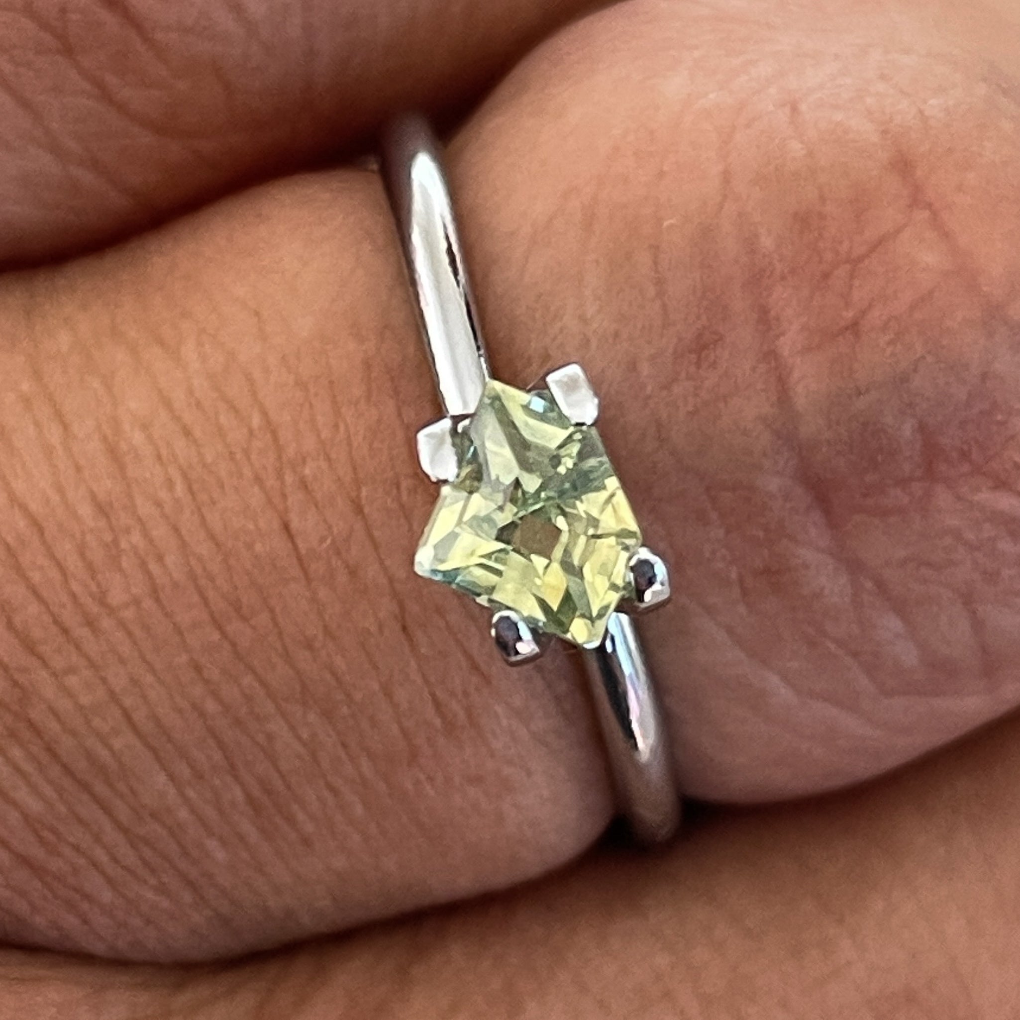 Natural pale green-yellow sapphire, 0.72 Ct shield cut teal loose gemstone by NASHGEMS for engagement or custom jewelry.