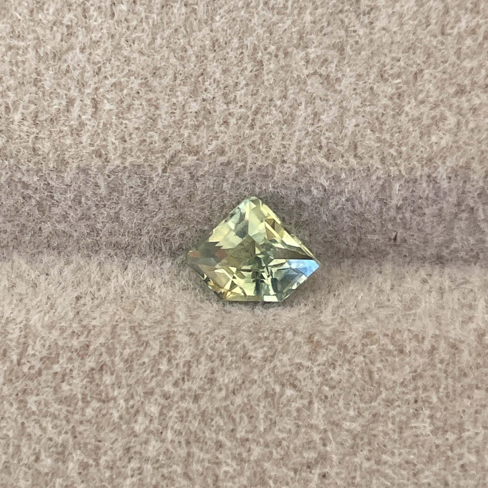 Natural pale green yellow sapphire, 0.72 Ct shield cut, loose teal sapphire from NASHGEMS for engagement or custom jewelry.