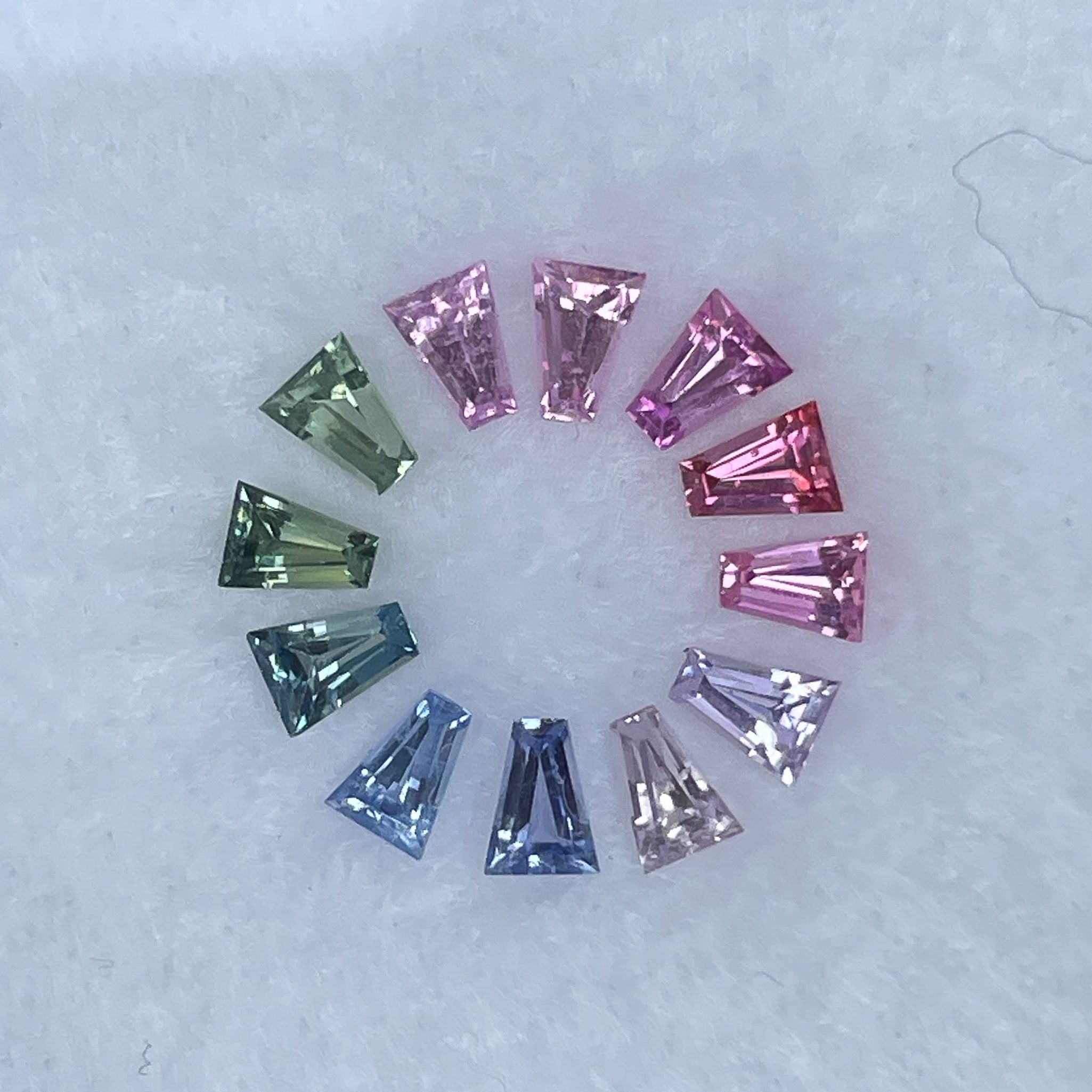 Natural rainbow sapphire lot with 1.37 carats of multi-coloured loose sapphires for custom jewelry by NASHGEMS.