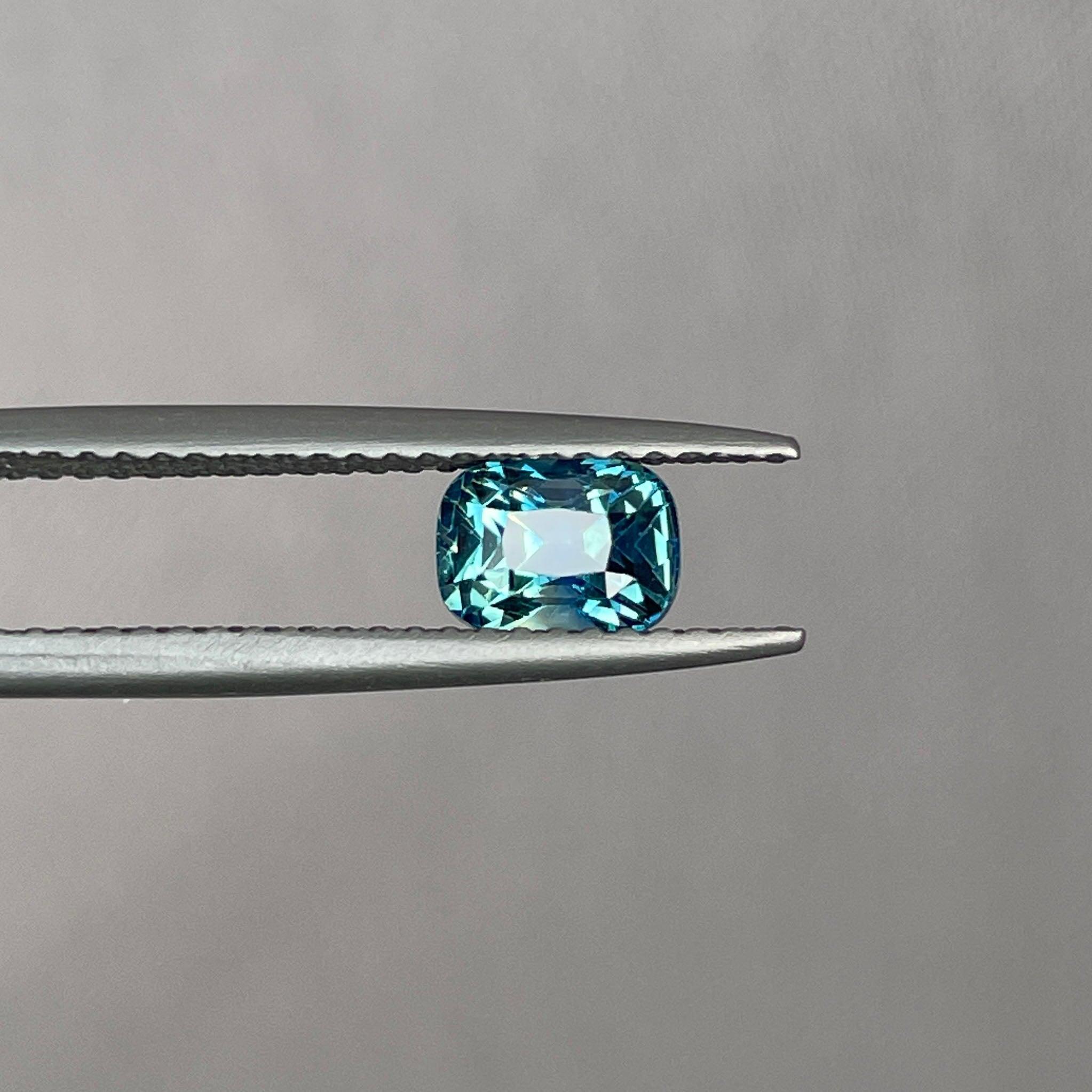 teal blue green parti sapphire cushion cut gem