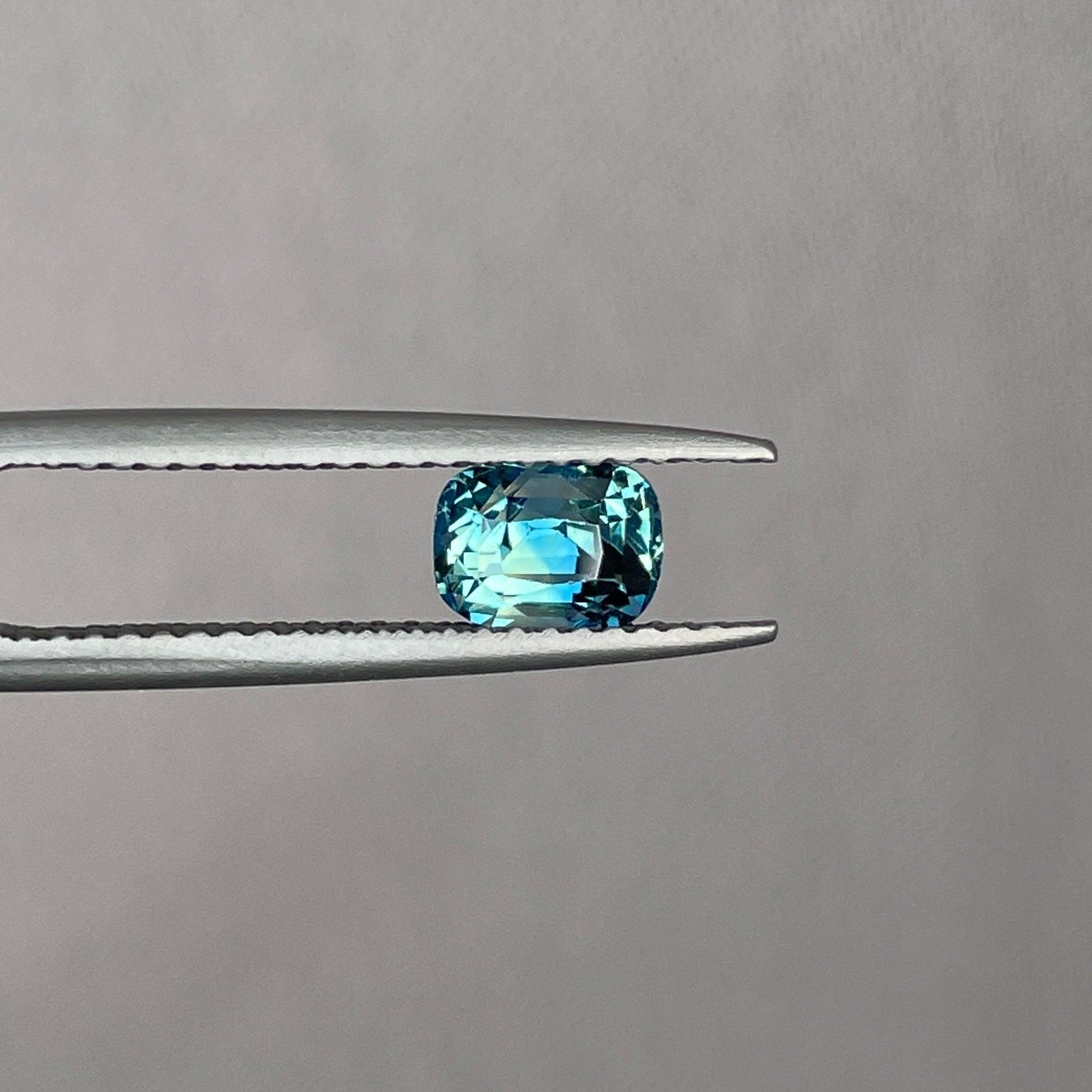 teal blue green parti sapphire cushion cut gem