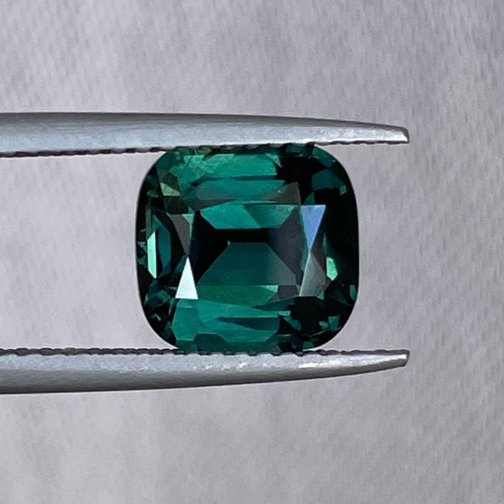 Teal blue-green parti sapphire cushion cut gemstone, 3.04 carats, for anniversary or engagement rings, pendant gifts for women or fiancés.