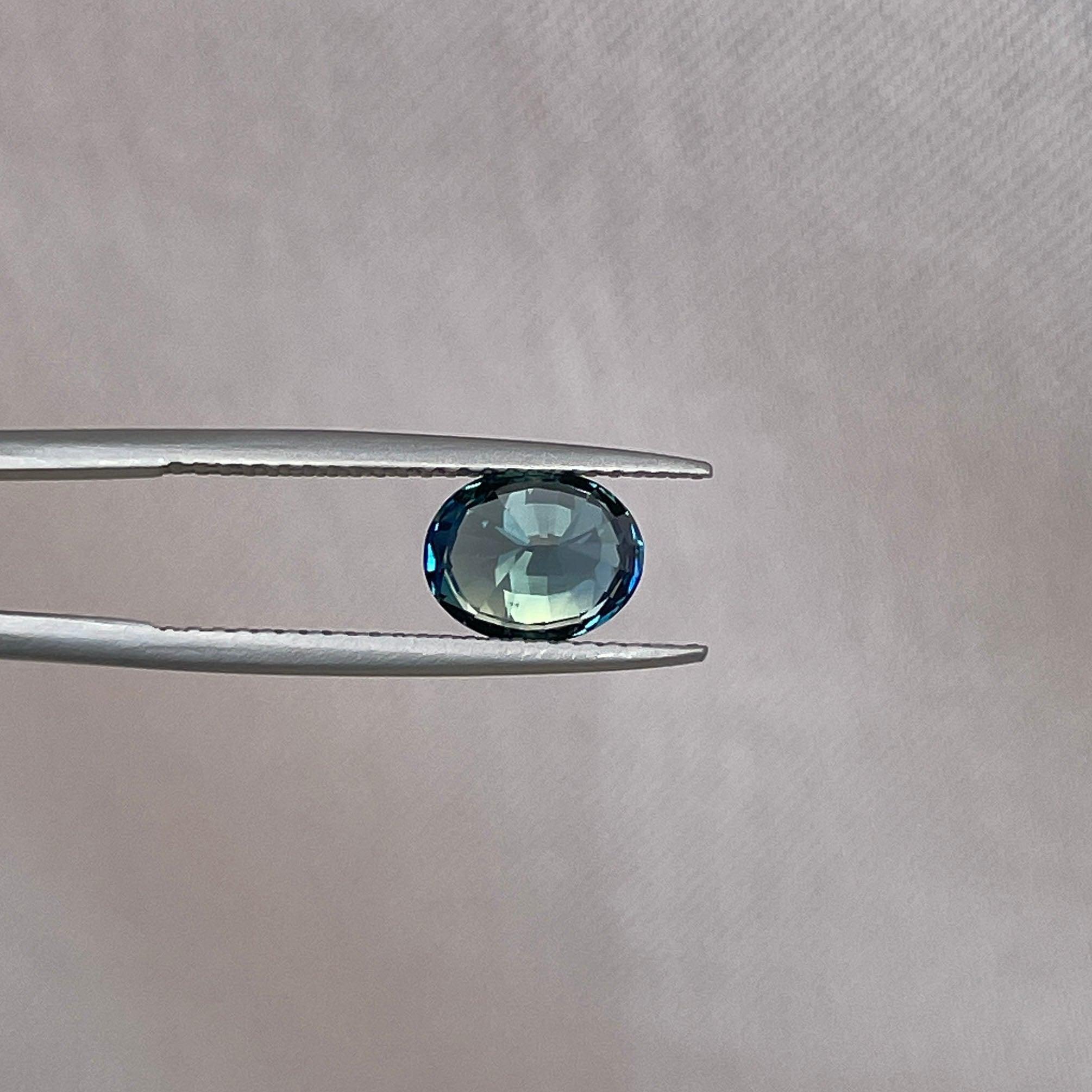 teal blue green parti sapphire oval cut gem
