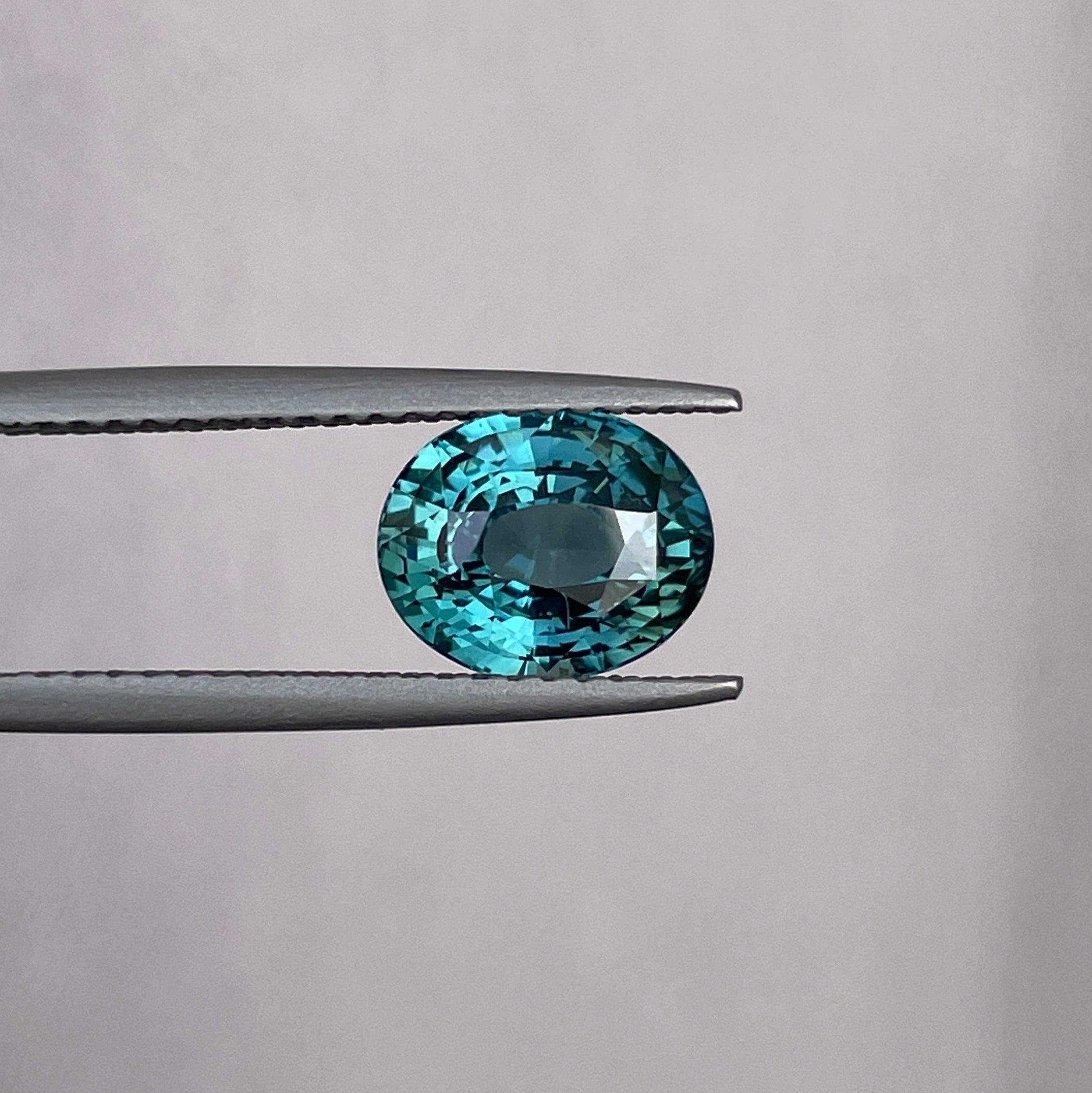 teal blue green parti sapphire oval cut gem
