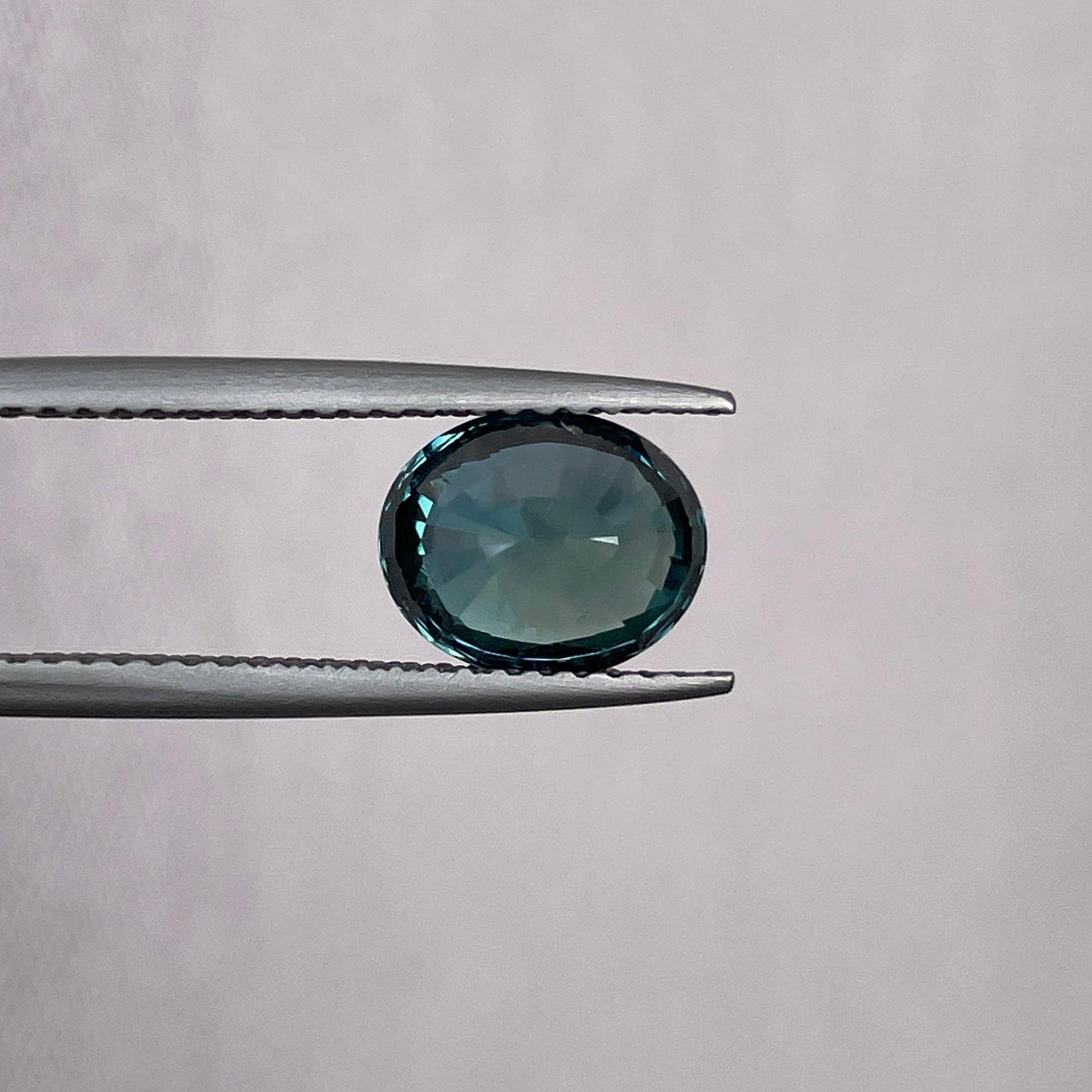 teal blue green parti sapphire oval cut gem