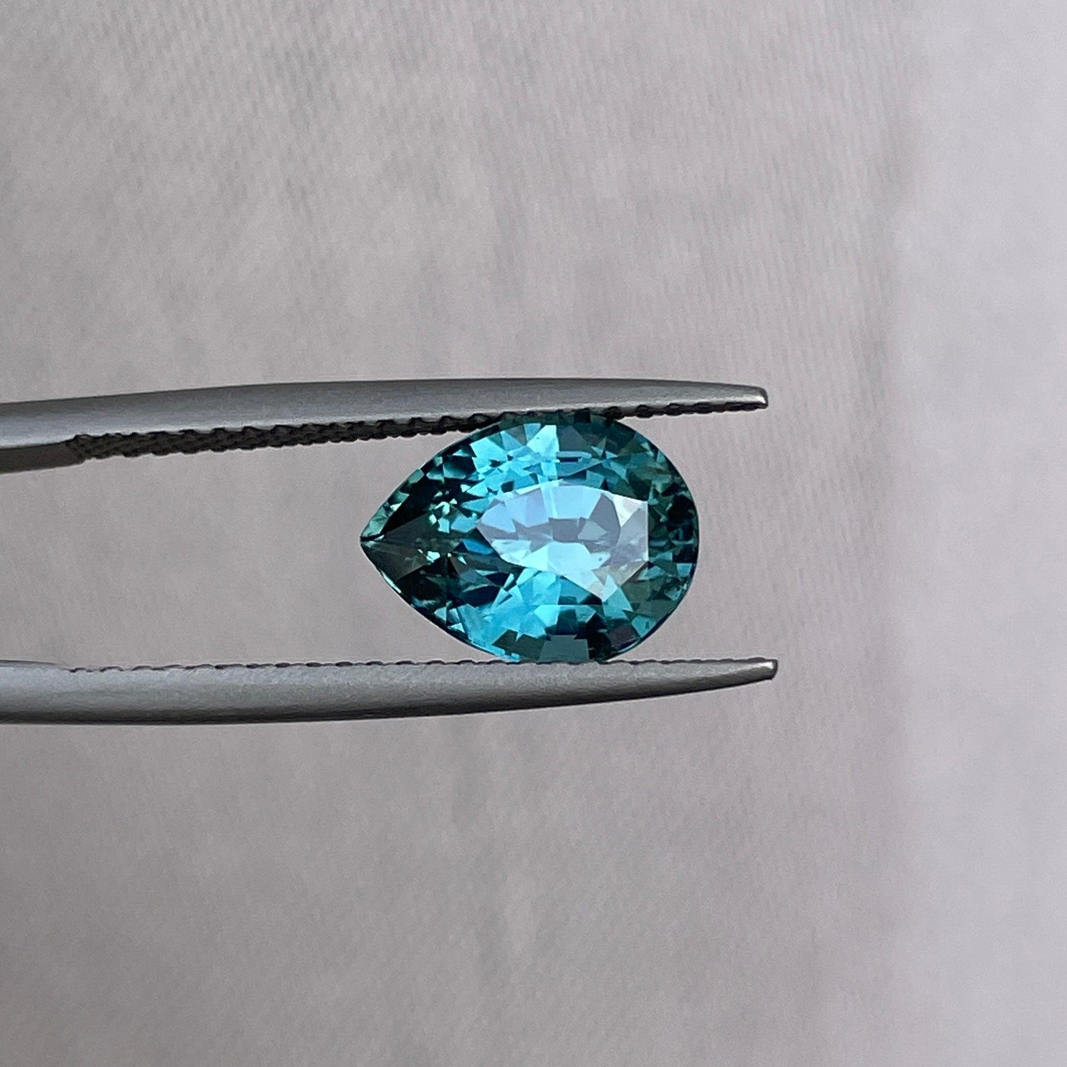teal blue green parti sapphire pear drop cut gem