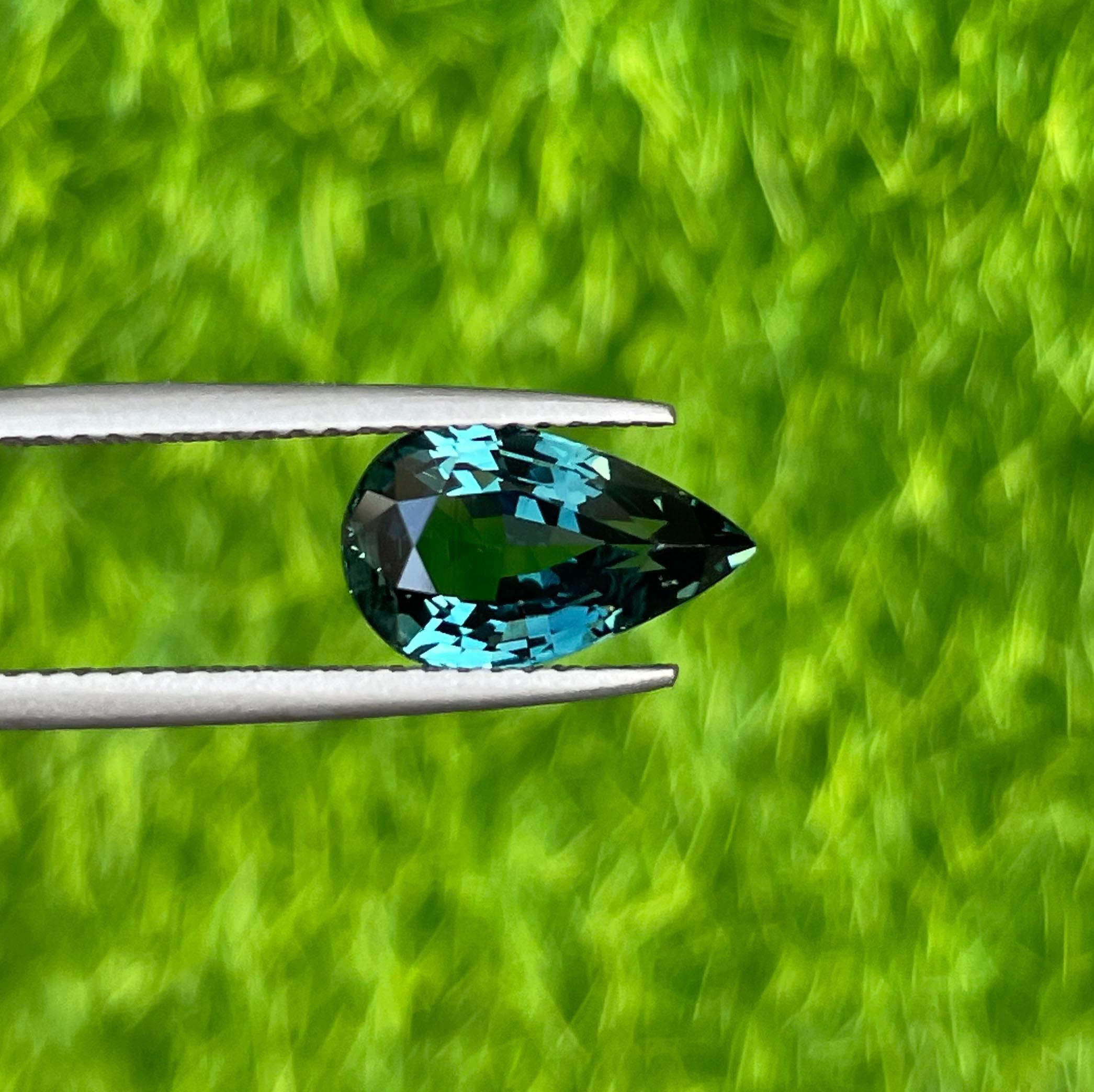 teal blue green parti sapphire pear drop cut gem