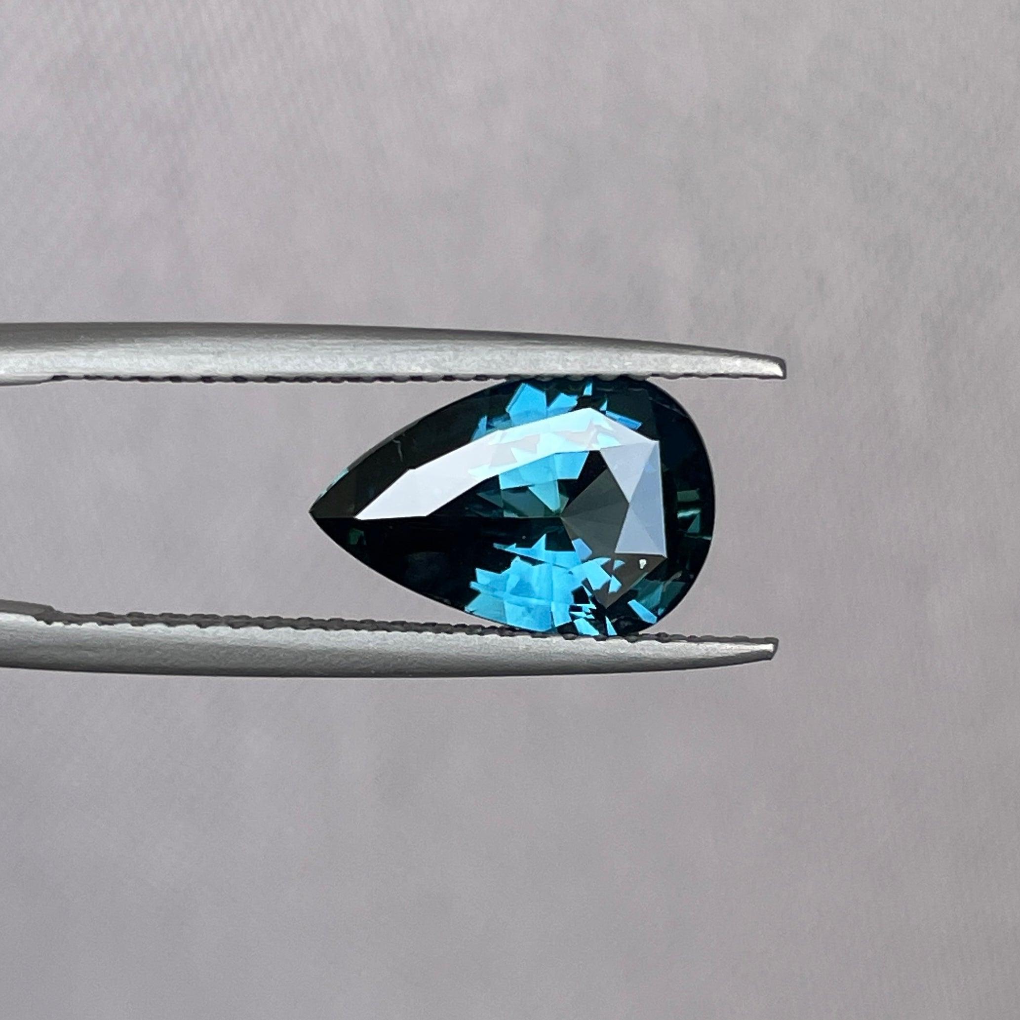 teal blue green parti sapphire pear drop cut gem