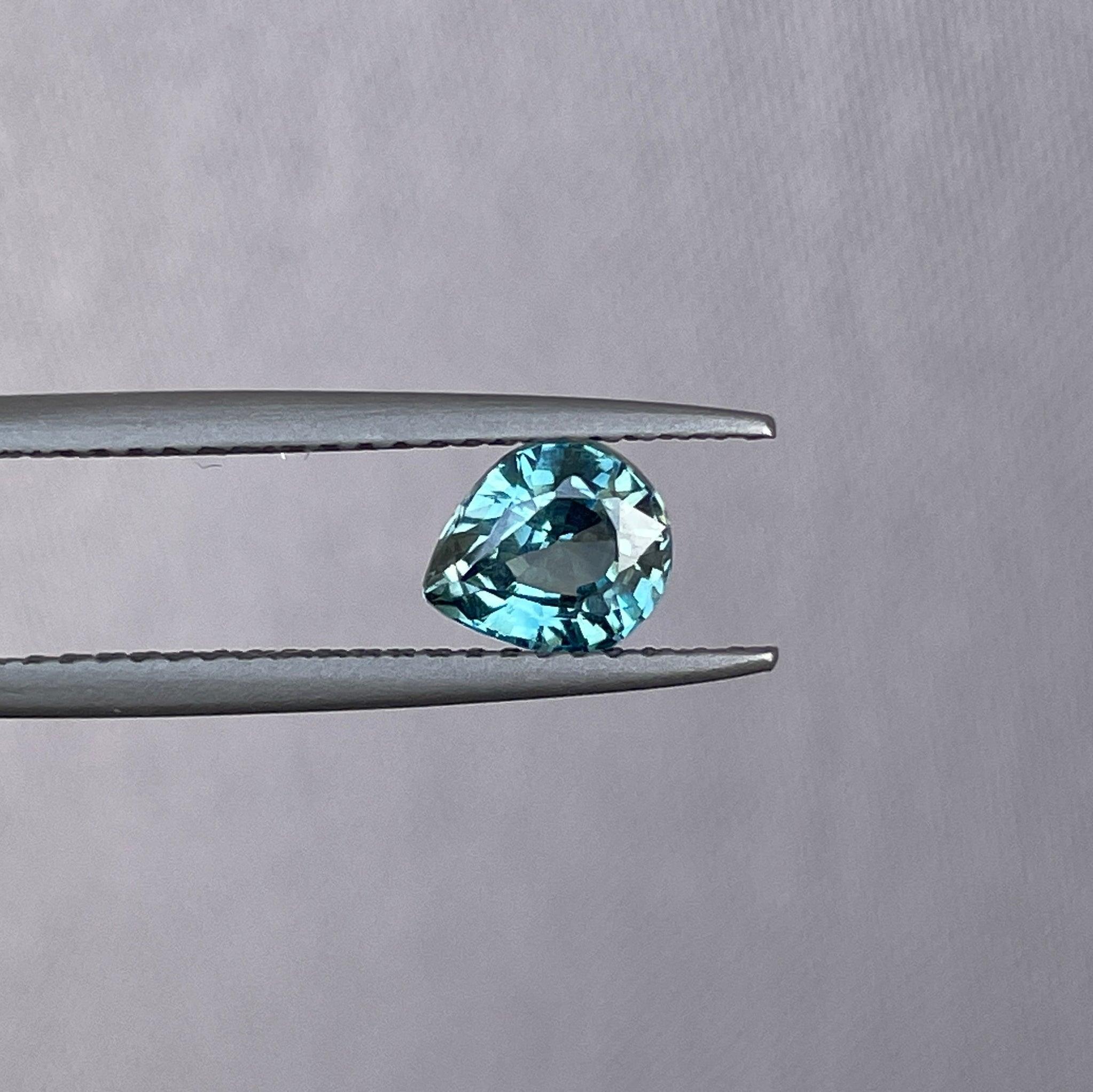 teal blue green parti sapphire pear drop cut gem