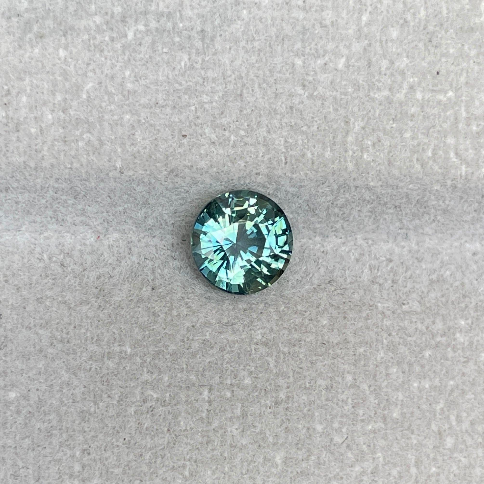 teal blue green parti sapphire round cut gem