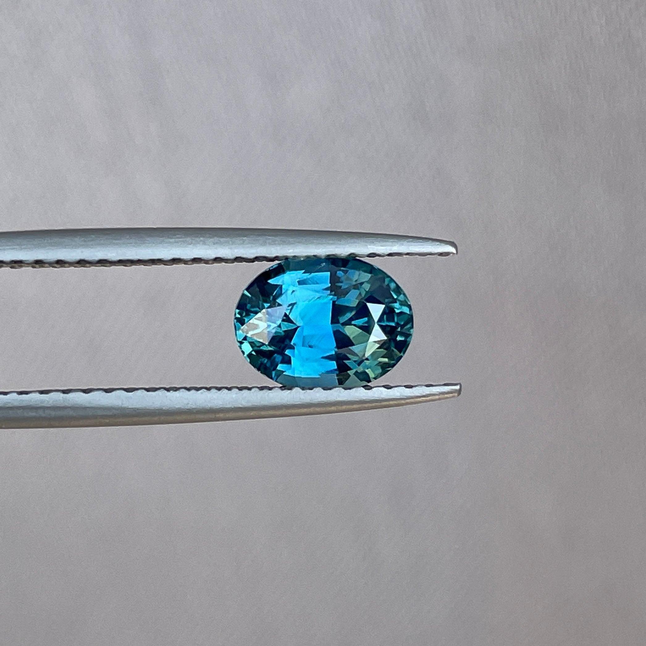 Teal sapphire engagement ring by NASHGEMS featuring a 1.60-carat gemstone in gold jewelry for wedding or promise occasions.