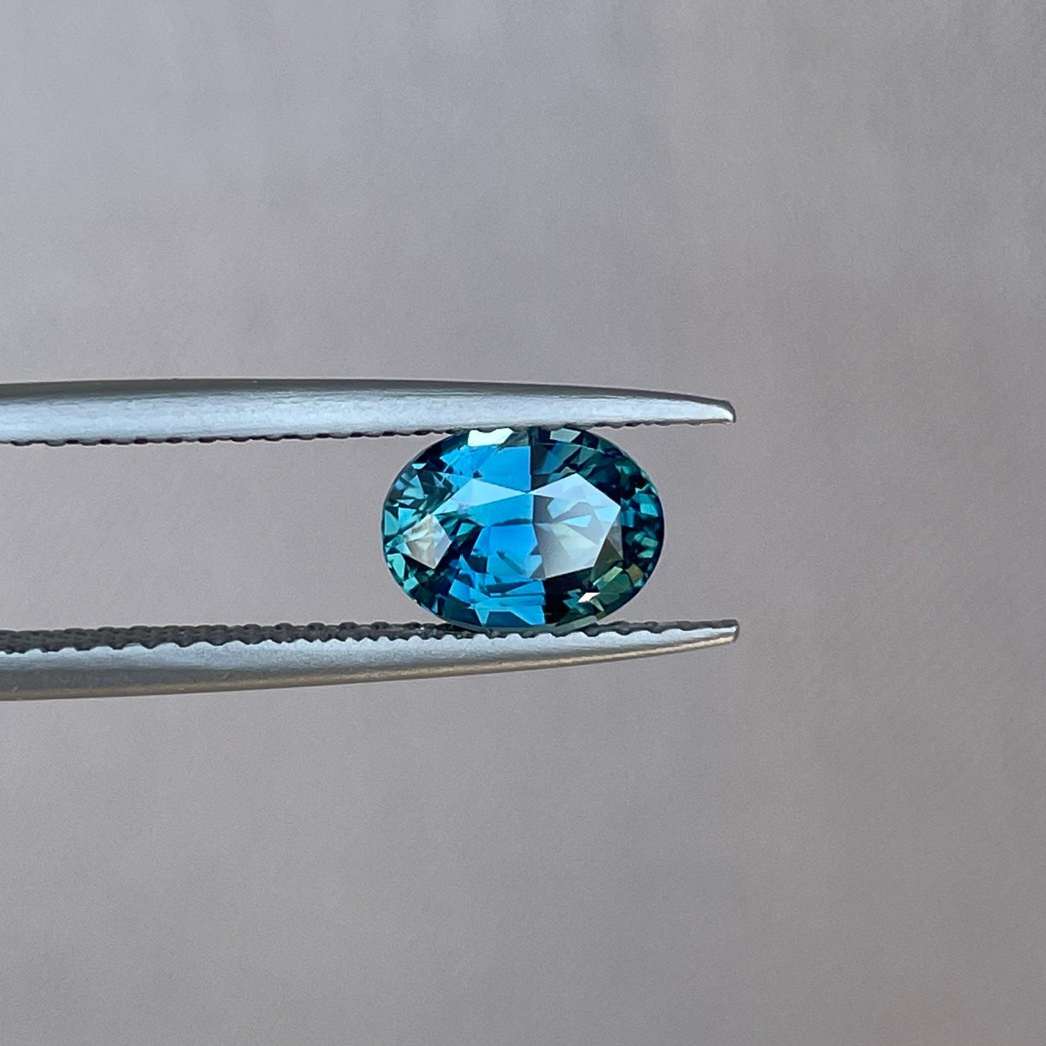 Teal sapphire engagement ring with gemstones and gold setting, 1.60 carats, from NASHGEMS, perfect for wedding or promise jewelry.
