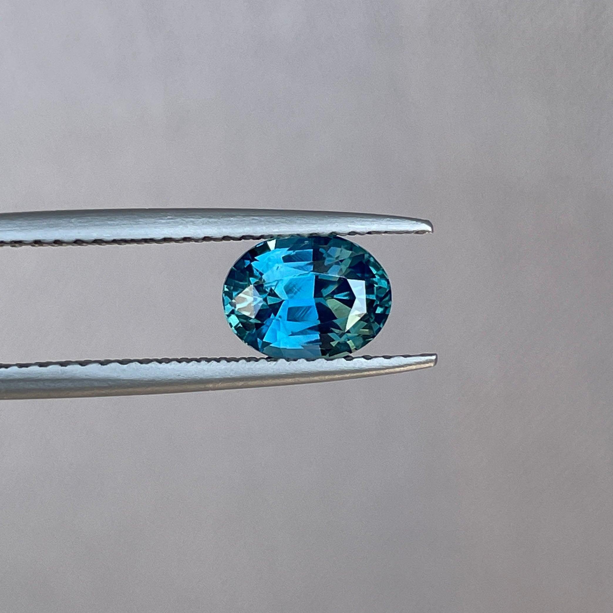 Teal sapphire engagement ring with 1.60 carats, gold jewelry, gemstone promise ring, perfect for birthdays or weddings.