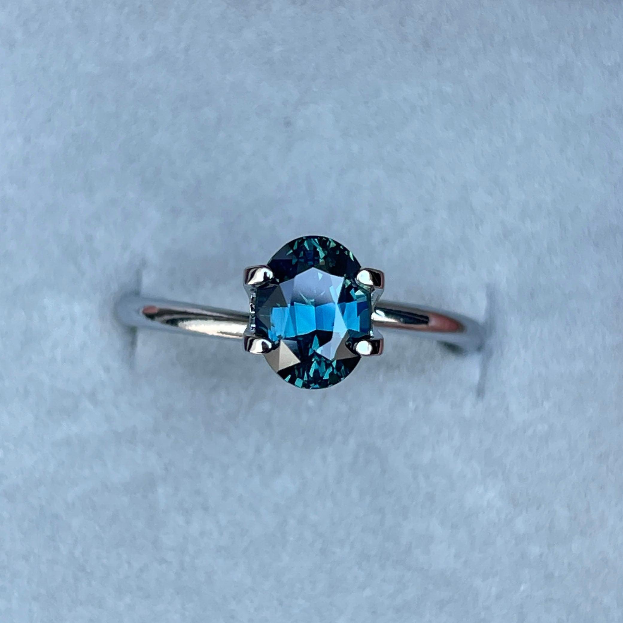 Teal sapphire engagement ring by NASHGEMS with 1.60 carat gemstone, gold band, perfect for wedding or promise jewelry.