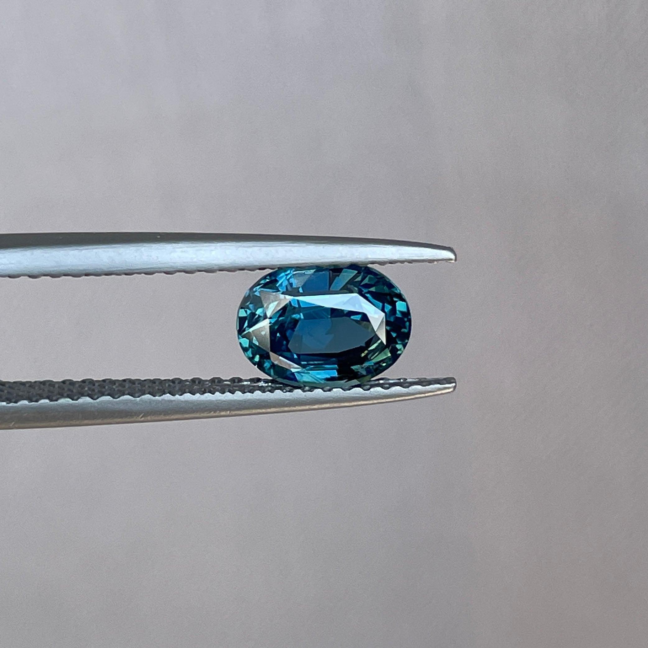 Teal sapphire engagement ring with gemstones, 1.60 carats, gold jewelry, NASHGEMS, featuring a sparkling teal sapphire centerpiece.