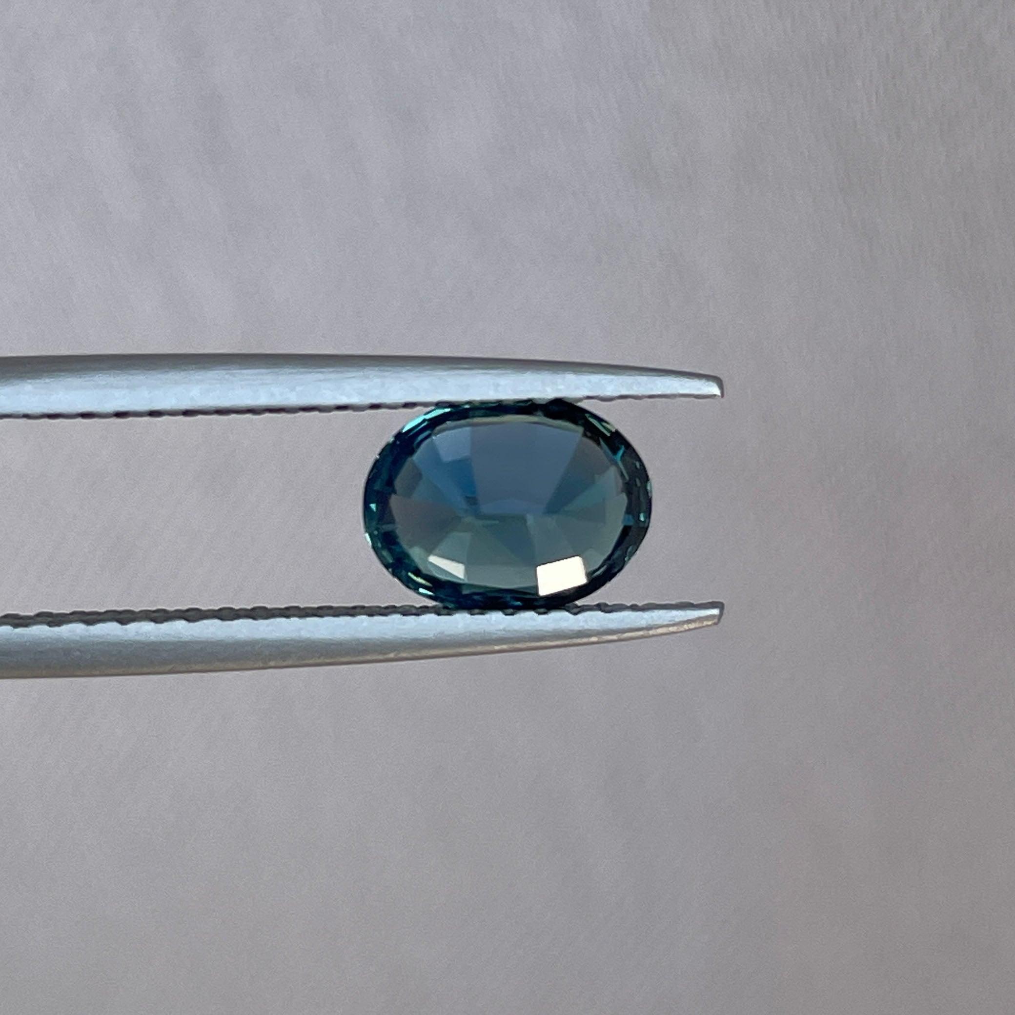 Teal sapphire engagement ring by NASHGEMS featuring a 1.60 carat gemstone, gold band, ideal for wedding or promise jewelry.