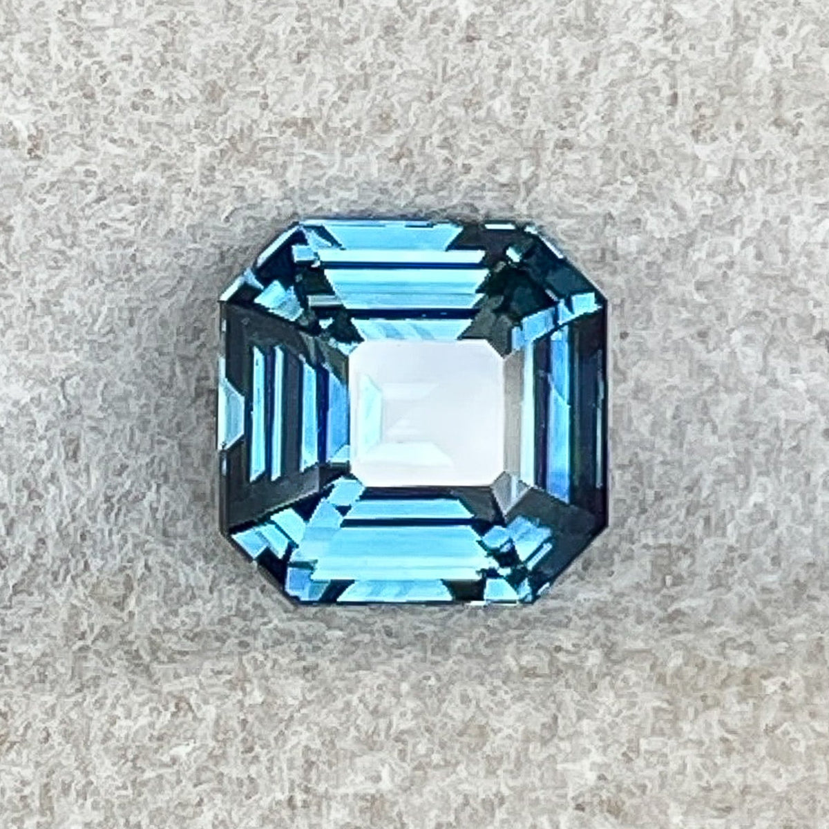 Natural teal blue sapphire 1.52 Ct emerald cut loose gemstone by NASHGEMS, perfect for engagement rings or custom jewelry.