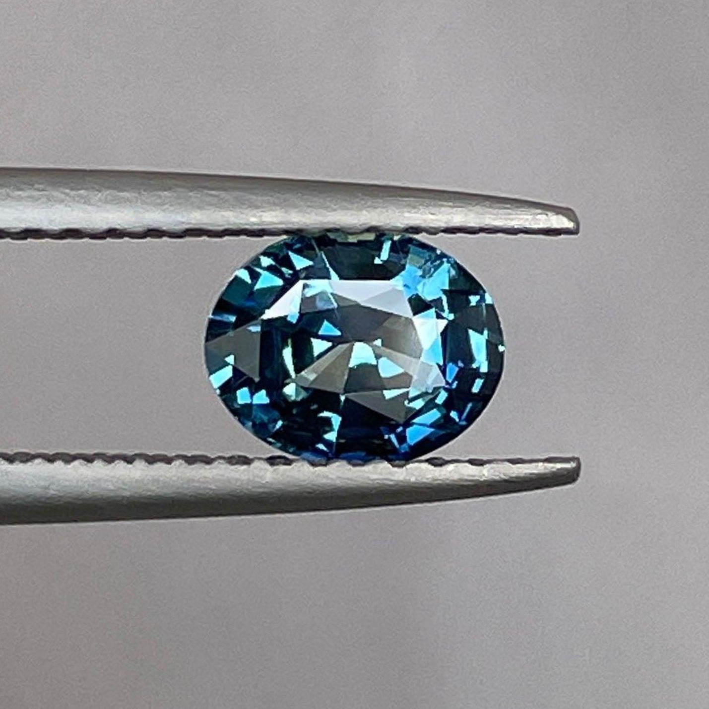 Natural teal sapphire gemstone, 1.05 carats oval shape, loose gemstone ideal for ring making by NASHGEMS.