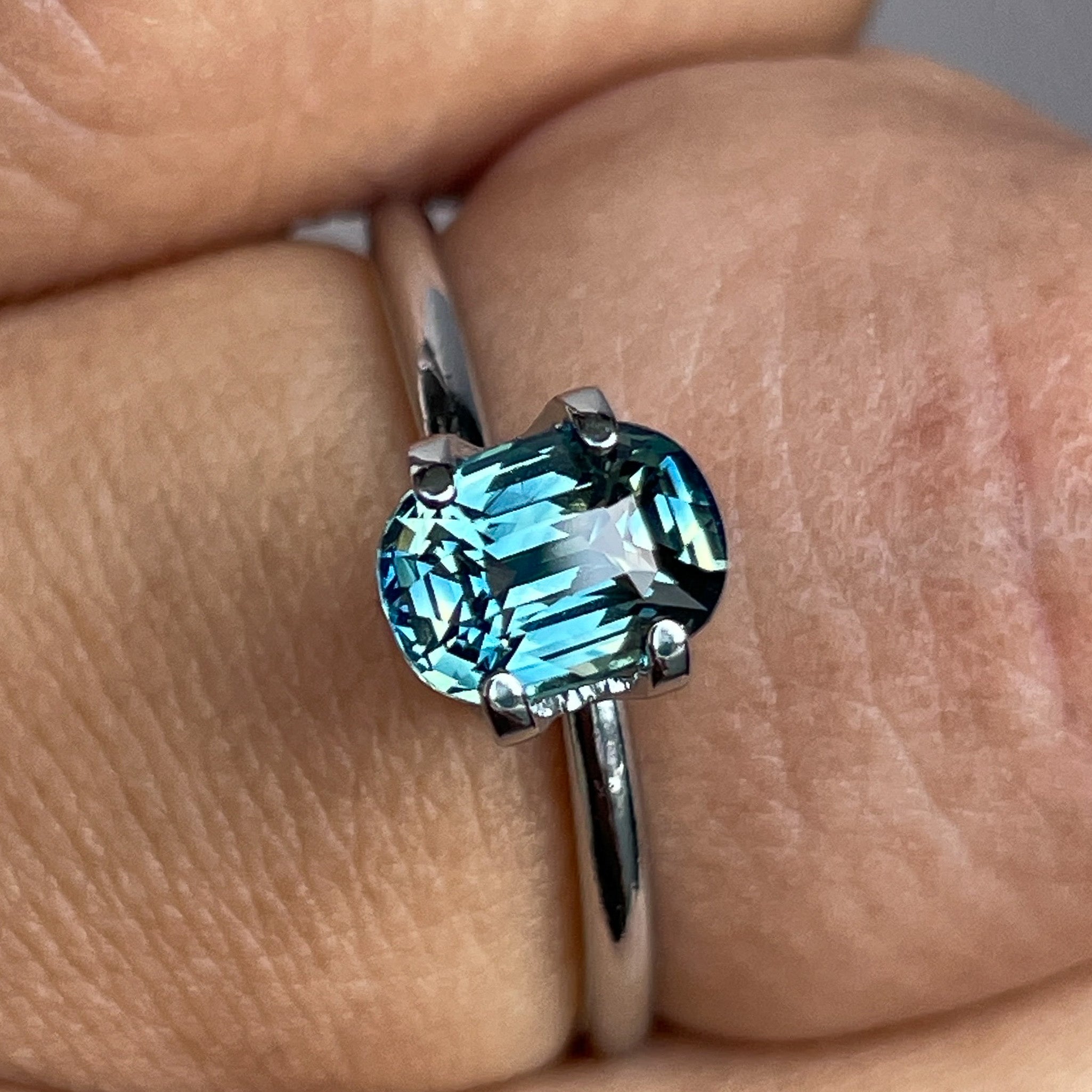 Natural teal sapphire by NASHGEMS, 1.36 Ct cushion cut loose gemstone with vibrant blue-green color for jewelry making.
