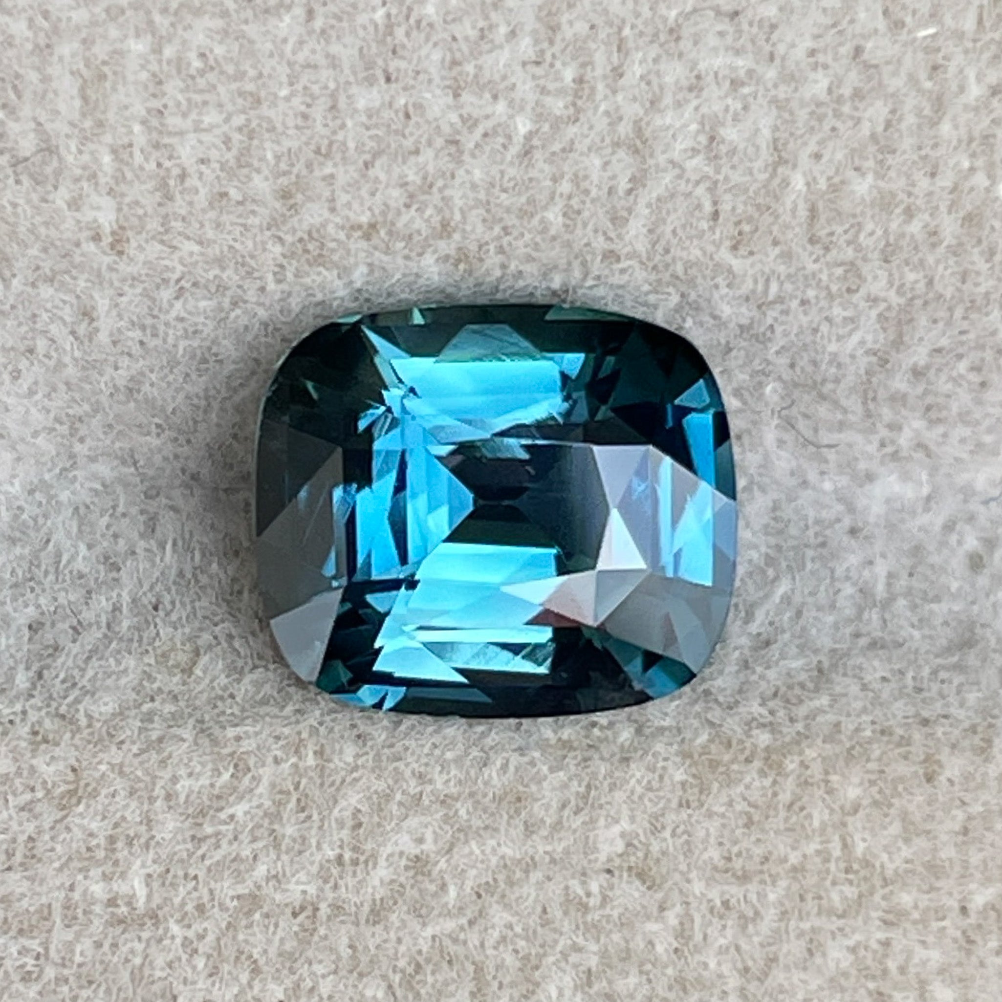 Natural teal blue sapphire 2.52 Ct cushion cut loose gemstone from NASHGEMS, ideal for engagement rings or custom jewelry.