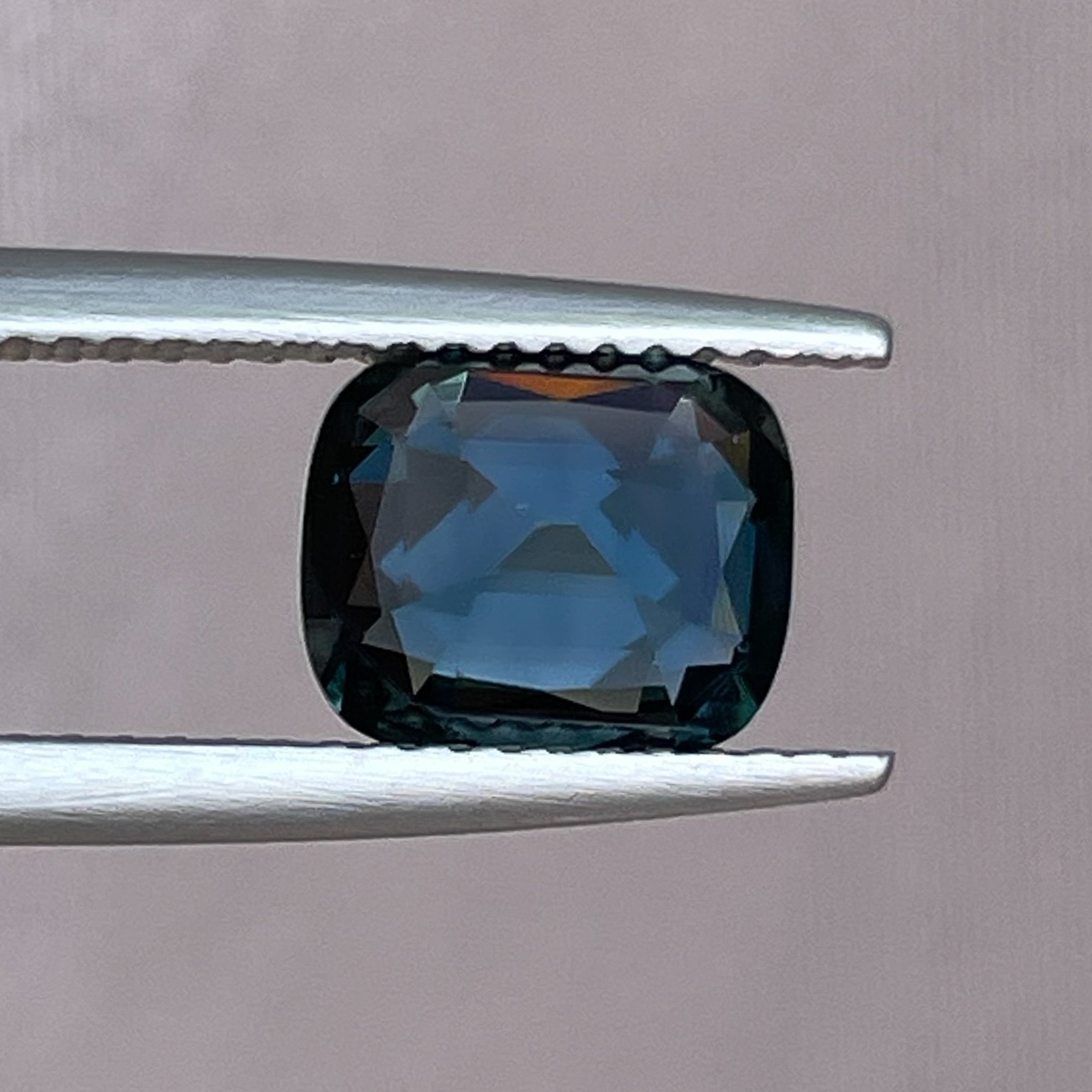 Teal blue sapphire loose gemstone, 2.52 Ct cushion cut, heat treated, ideal for engagement rings or custom jewelry.
