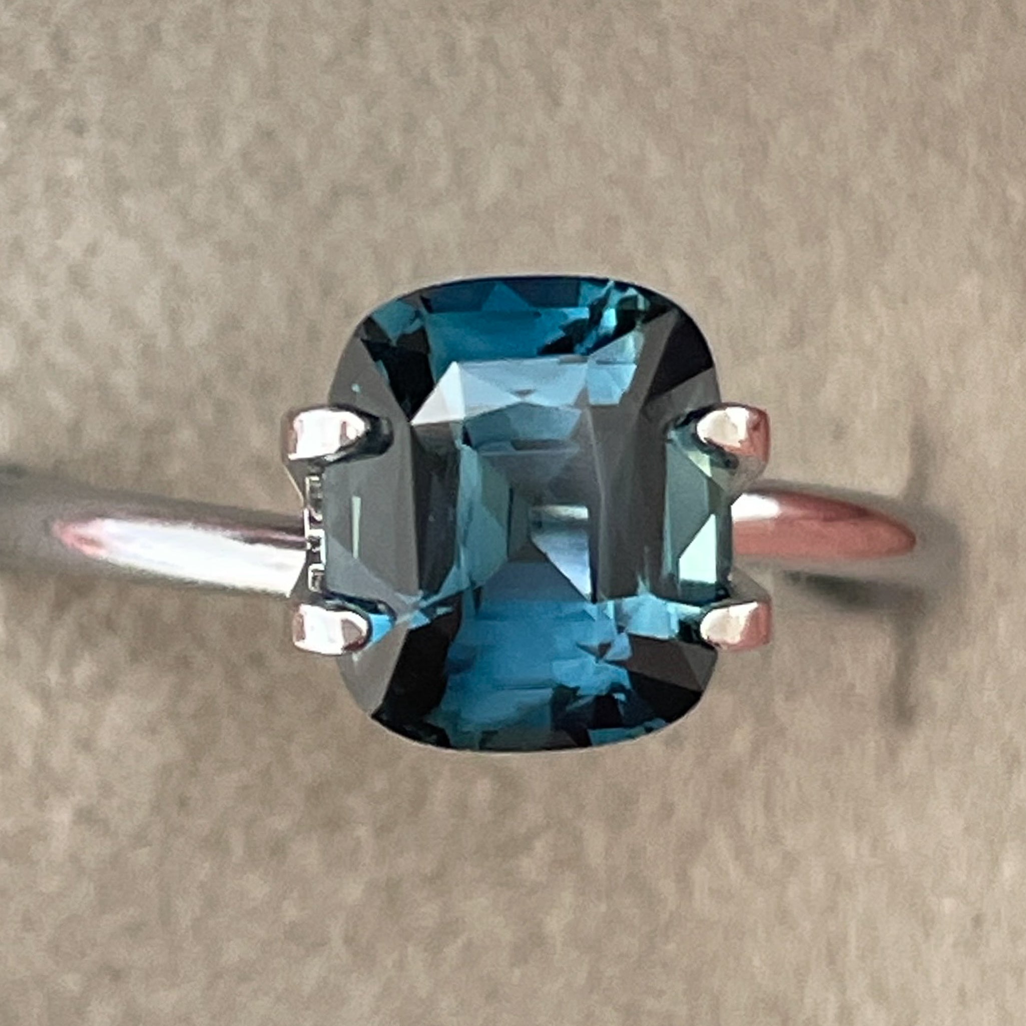 Natural teal blue sapphire loose gemstone, 2.52 ct cushion cut by NASHGEMS, heat treated, ideal for engagement rings or custom jewelry.
