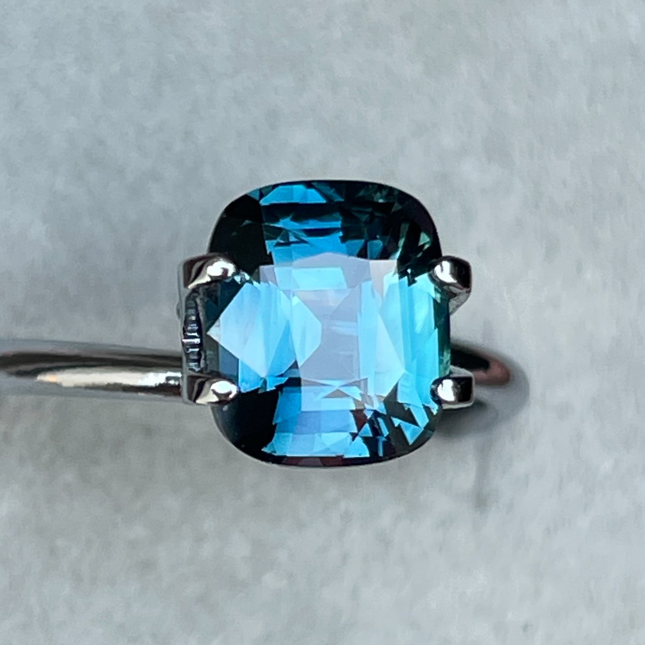 Natural teal blue sapphire 2.52 Ct cushion cut loose gemstone for engagement or custom jewelry by NASHGEMS.