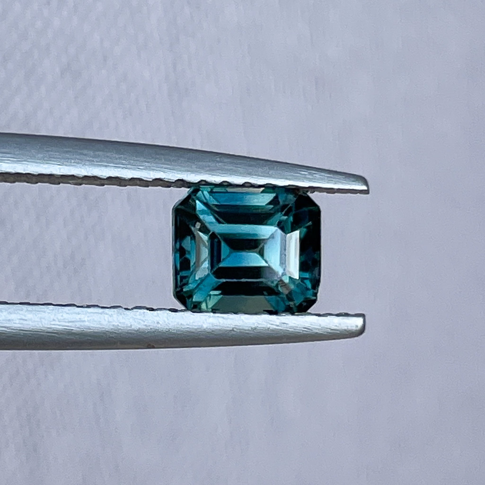 Natural teal blue sapphire 1.06 Ct emerald cut loose gemstone by NASHGEMS, ideal for engagement rings or custom jewelry.