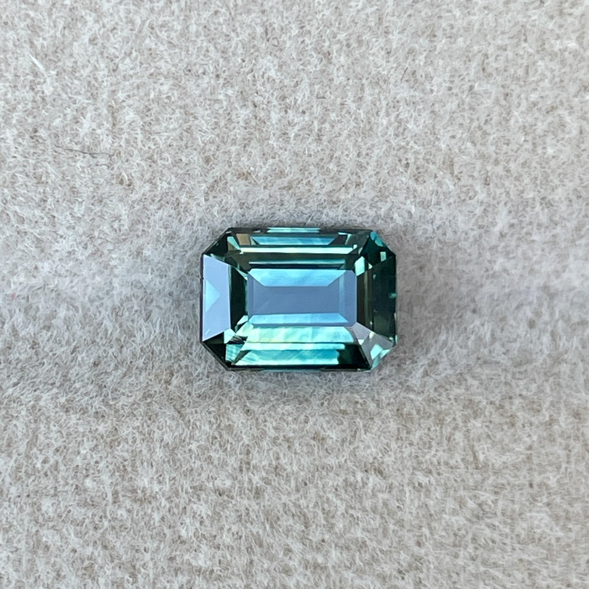 Natural teal sapphire loose stone, 1.52 Ct emerald cut by NASHGEMS, ideal for engagement rings or custom jewelry designs.