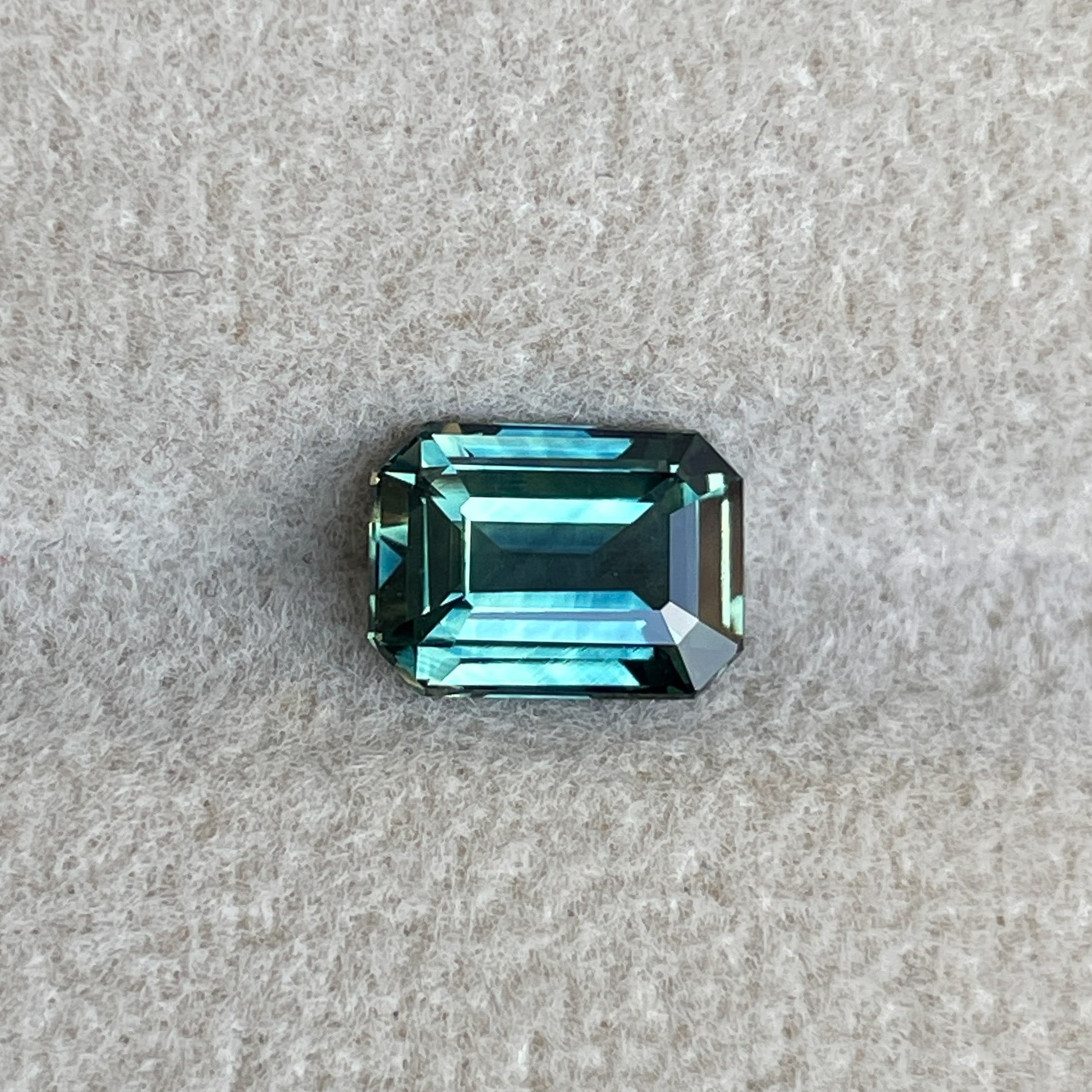 Natural teal sapphire loose stone with emerald cut, 1.52 Ct, no heat, suitable for engagement rings or custom jewelry by NASHGEMS.