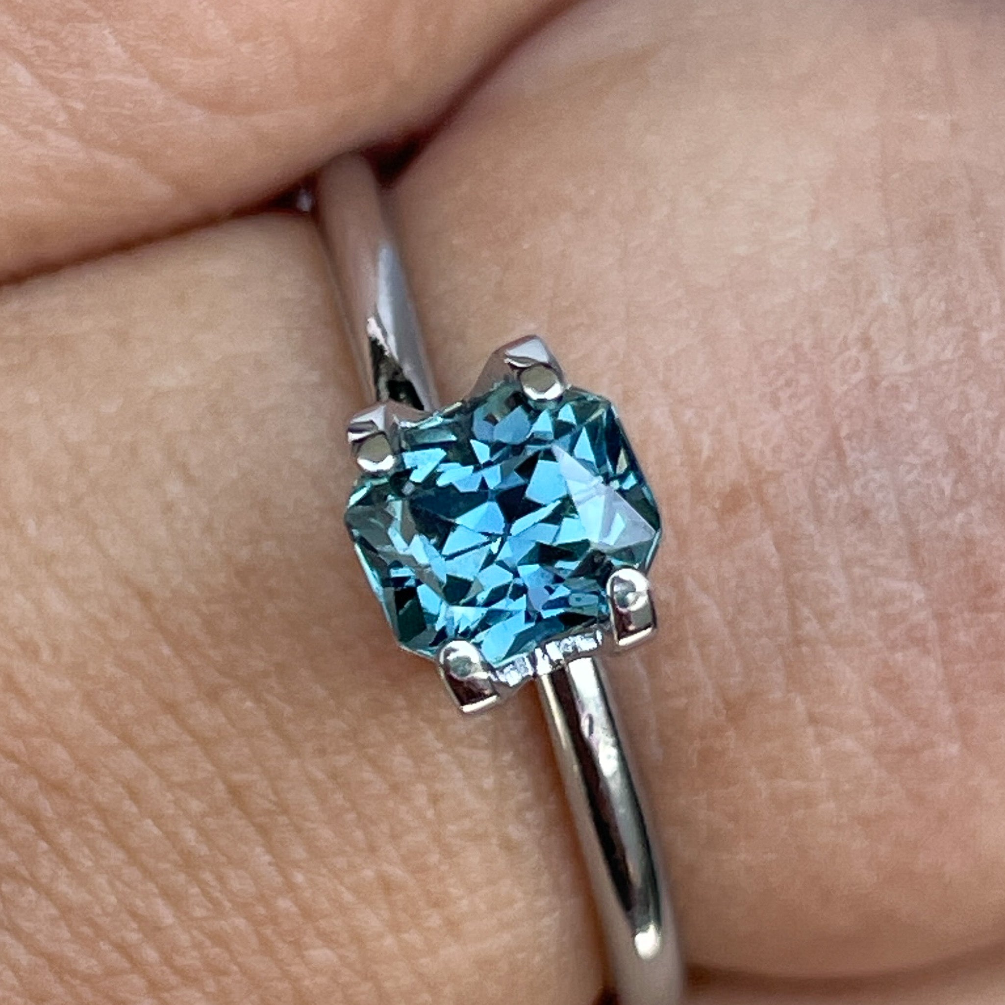 Natural teal blue sapphire 0.98 Ct radiant cut loose gemstone by NASHGEMS, perfect for engagement rings or custom jewelry.