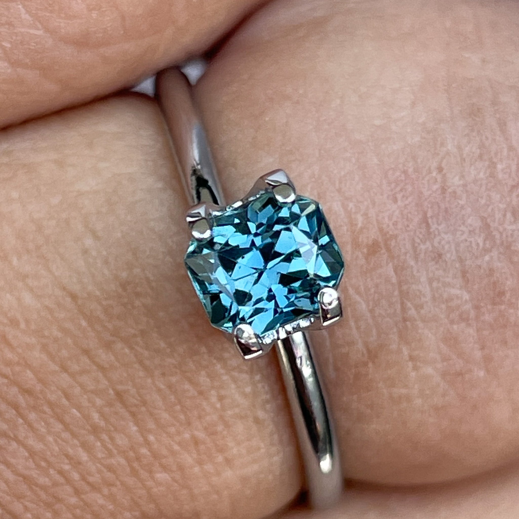 Teal blue sapphire loose gemstone 0.98 Ct radiant cut by NASHGEMS, ideal for engagement rings or custom jewelry.