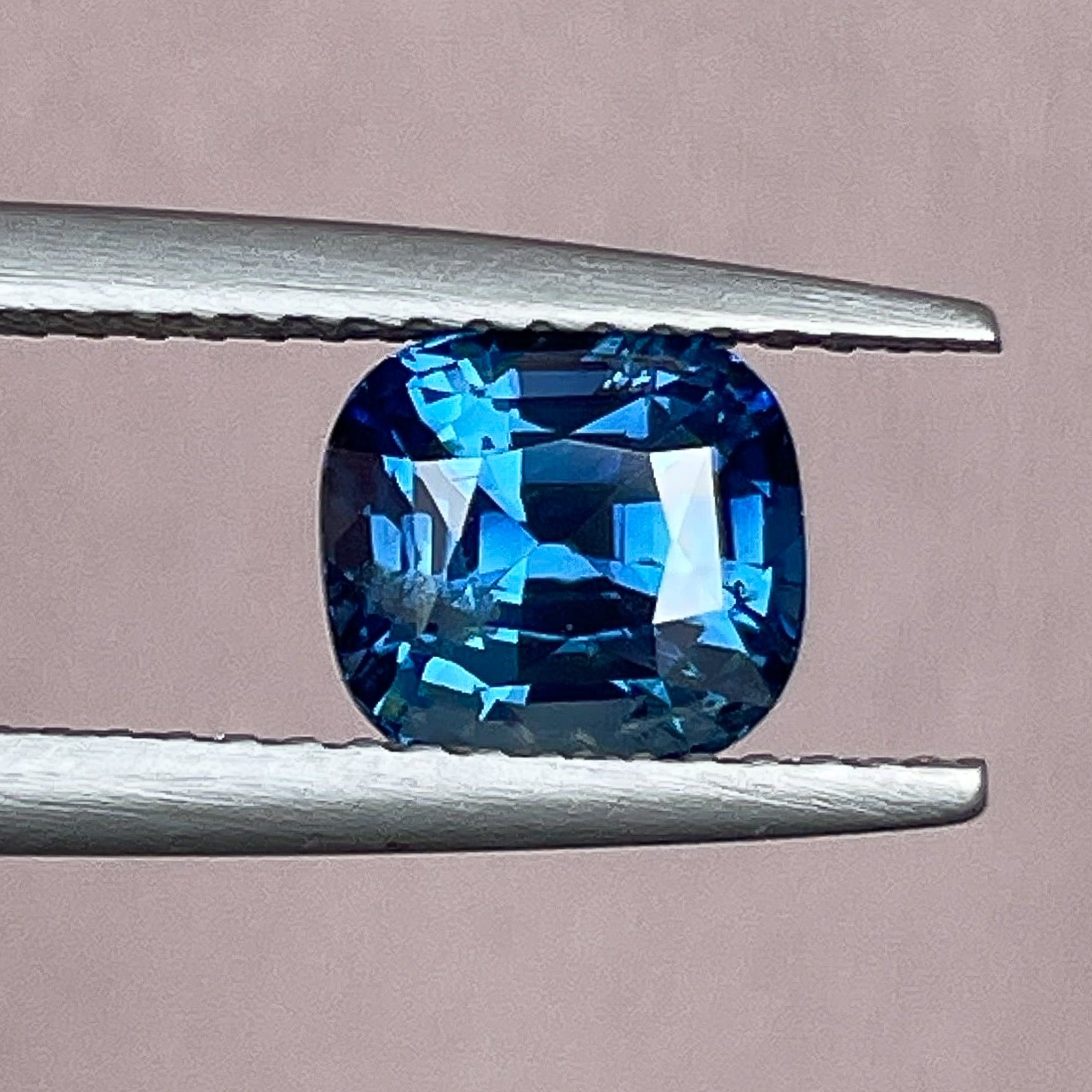Natural teal blue sapphire, 2.07 Ct cushion cut loose gemstone from NASHGEMS, suitable for engagement rings or custom jewelry.