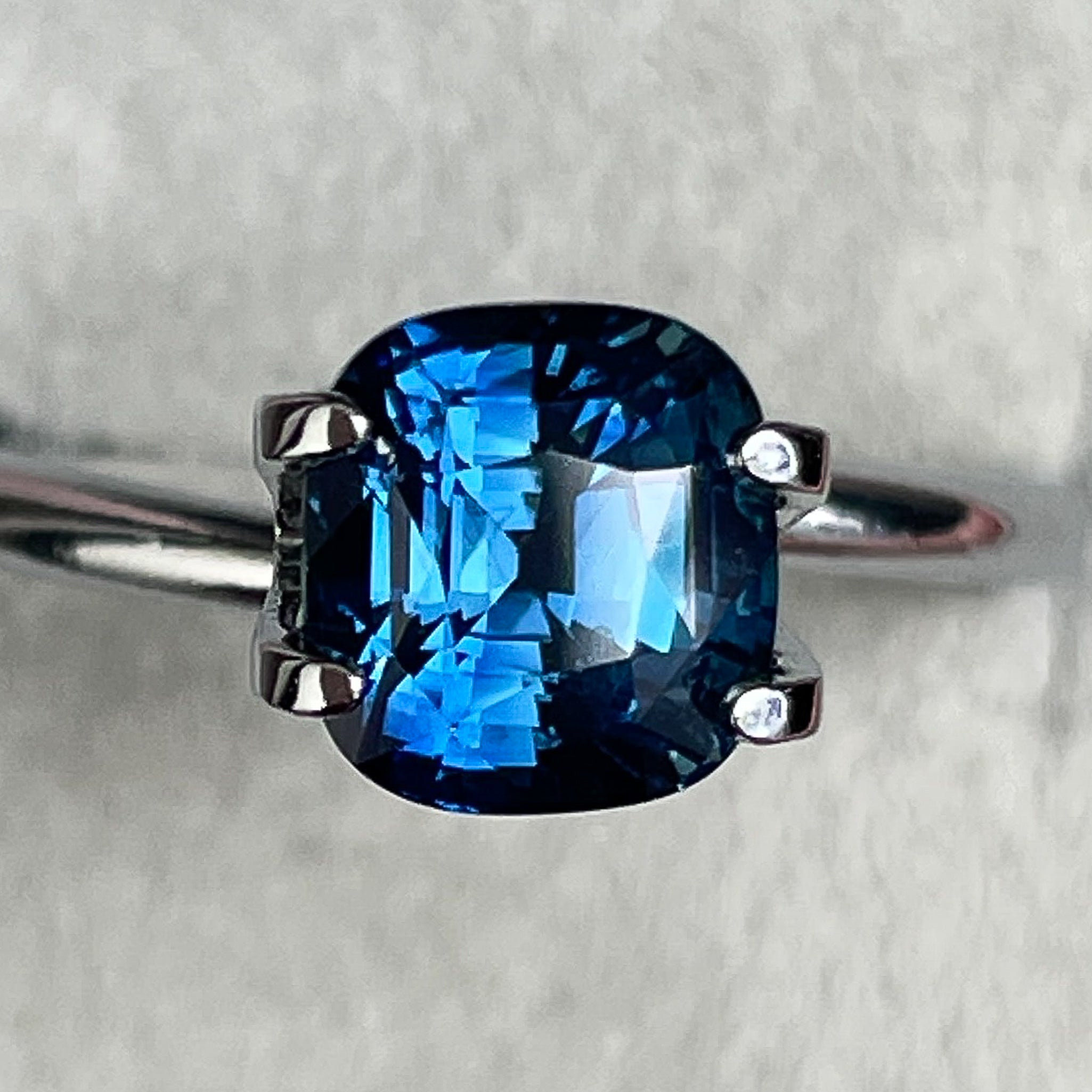 Natural teal blue sapphire loose stone, 2.07 ct cushion cut by NASHGEMS, ideal for engagement rings or custom jewelry designs.