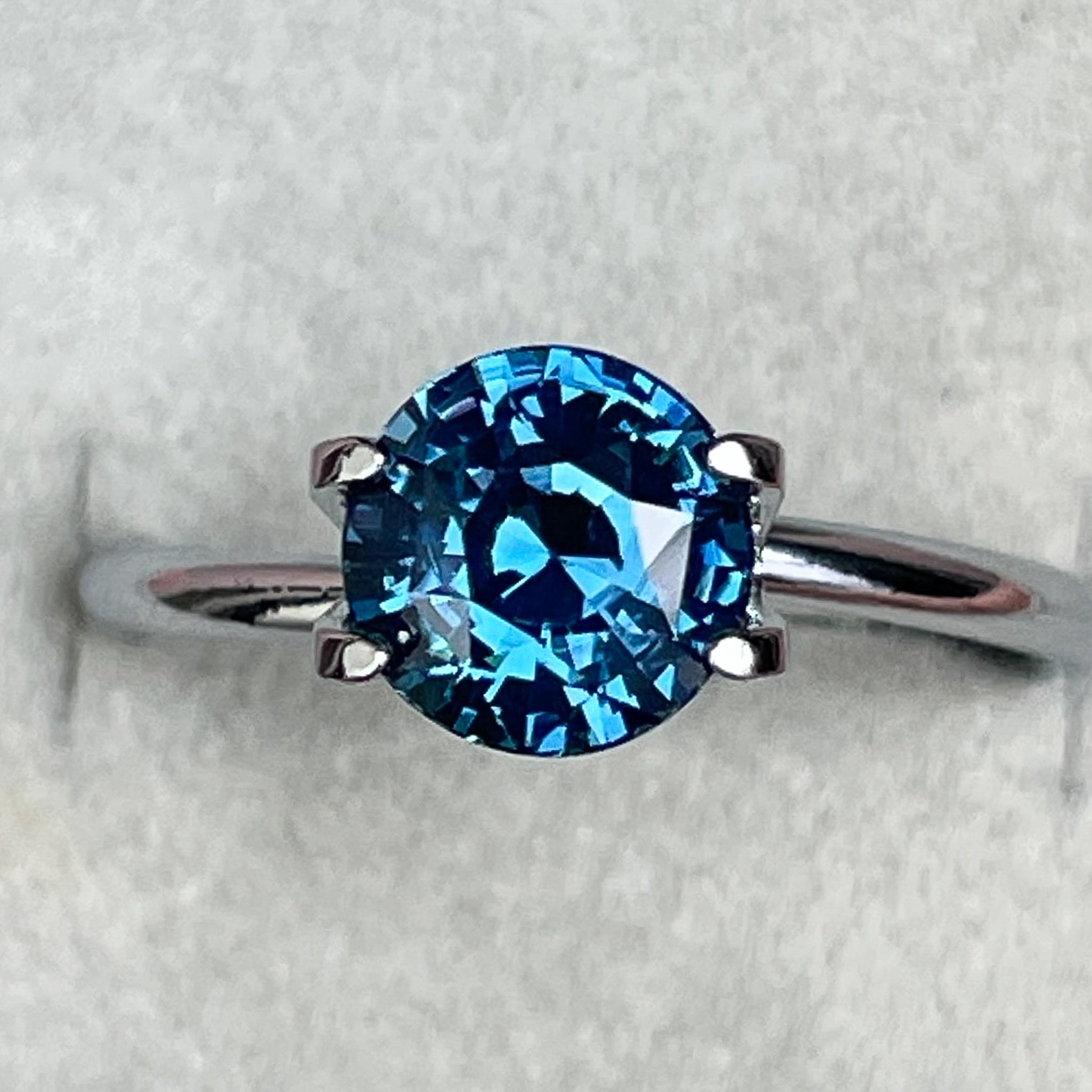 Natural teal blue sapphire 2.10 Ct round cut loose gemstone by NASHGEMS, ideal for engagement rings or custom jewelry.