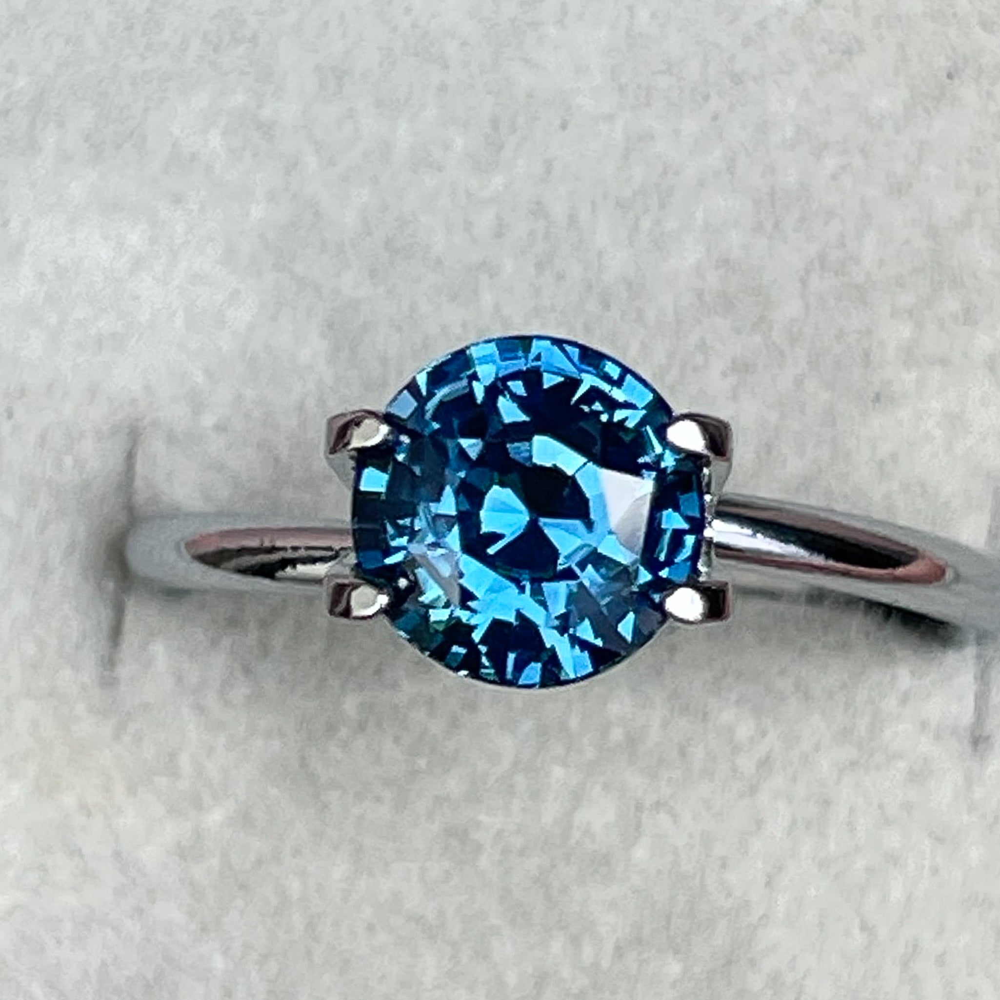 Natural teal blue sapphire, 2.10 Ct round cut, loose gemstone from NASHGEMS for jewelry or engagement rings.